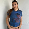 Woman Dressed in Y2K 00s Designer Just Cavalli cowgirl t-shirt featuring a woman cowgirl graphic print with western-style text. 