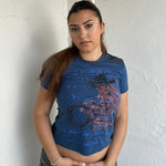 Woman Dressed in Y2K 00s Designer Just Cavalli cowgirl t-shirt featuring a woman cowgirl graphic print with western-style text. 