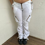 Woman Dressed in Y2K 00s white low-rise cargo pants, classic cargo pocket detailing and strap details.