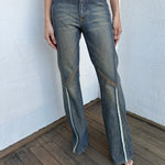 Woman wearing a Y2K 00s Ralph Lauren collab Chaps Jeans warm wash low rise flared 
