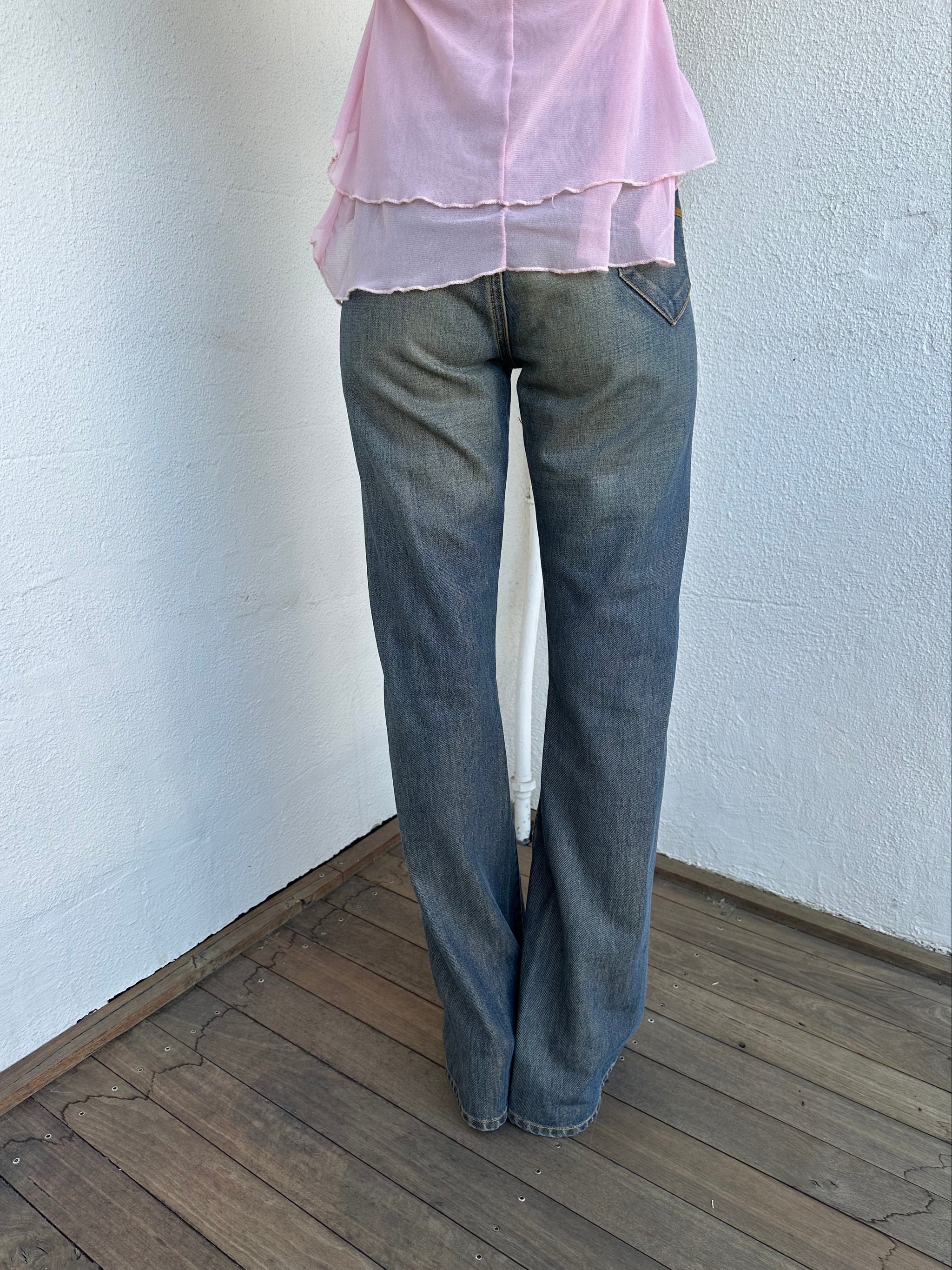 Woman wearing a Y2K 00s Ralph Lauren collab Chaps Jeans warm wash low rise flared 