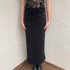 Woman wearing a Y2K 00s pimkie Y2K black with Chinese red embroidered details maxi skirt 