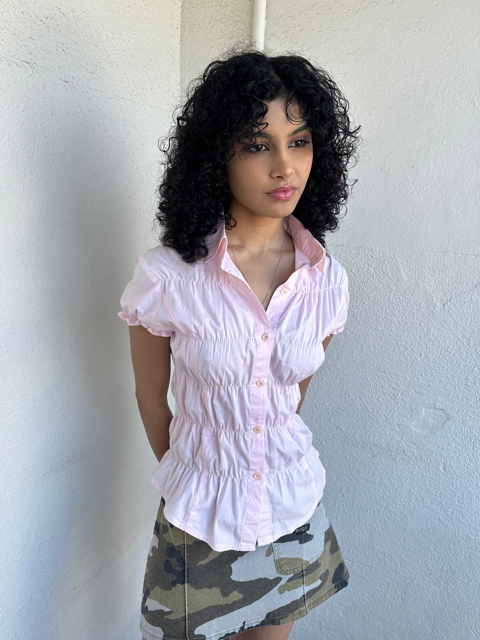 Women wearing a 00s Y2K Baby pink reworked cinched shirt featuring gathered detailing at the waist for a fitted silhouette.