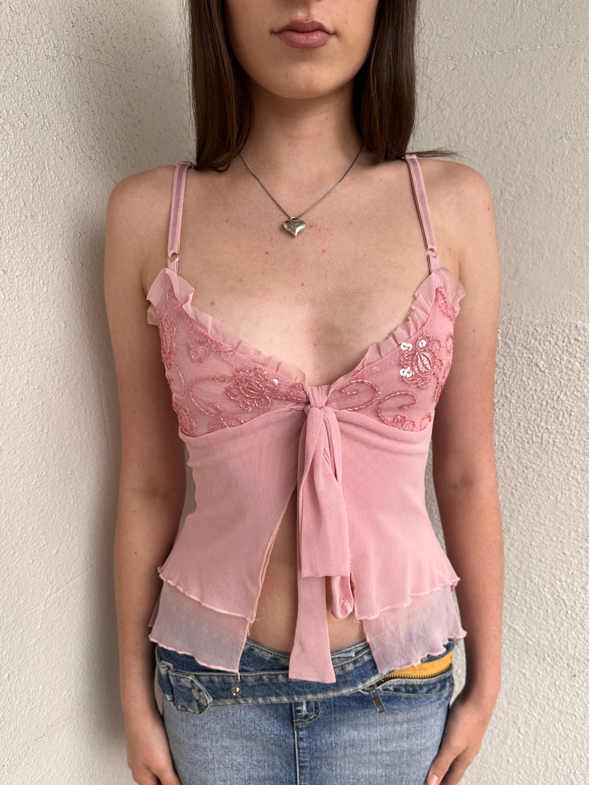Woman wearing a Y2K 00s Baby Pink Sequin busted tie front Mesh Cami 