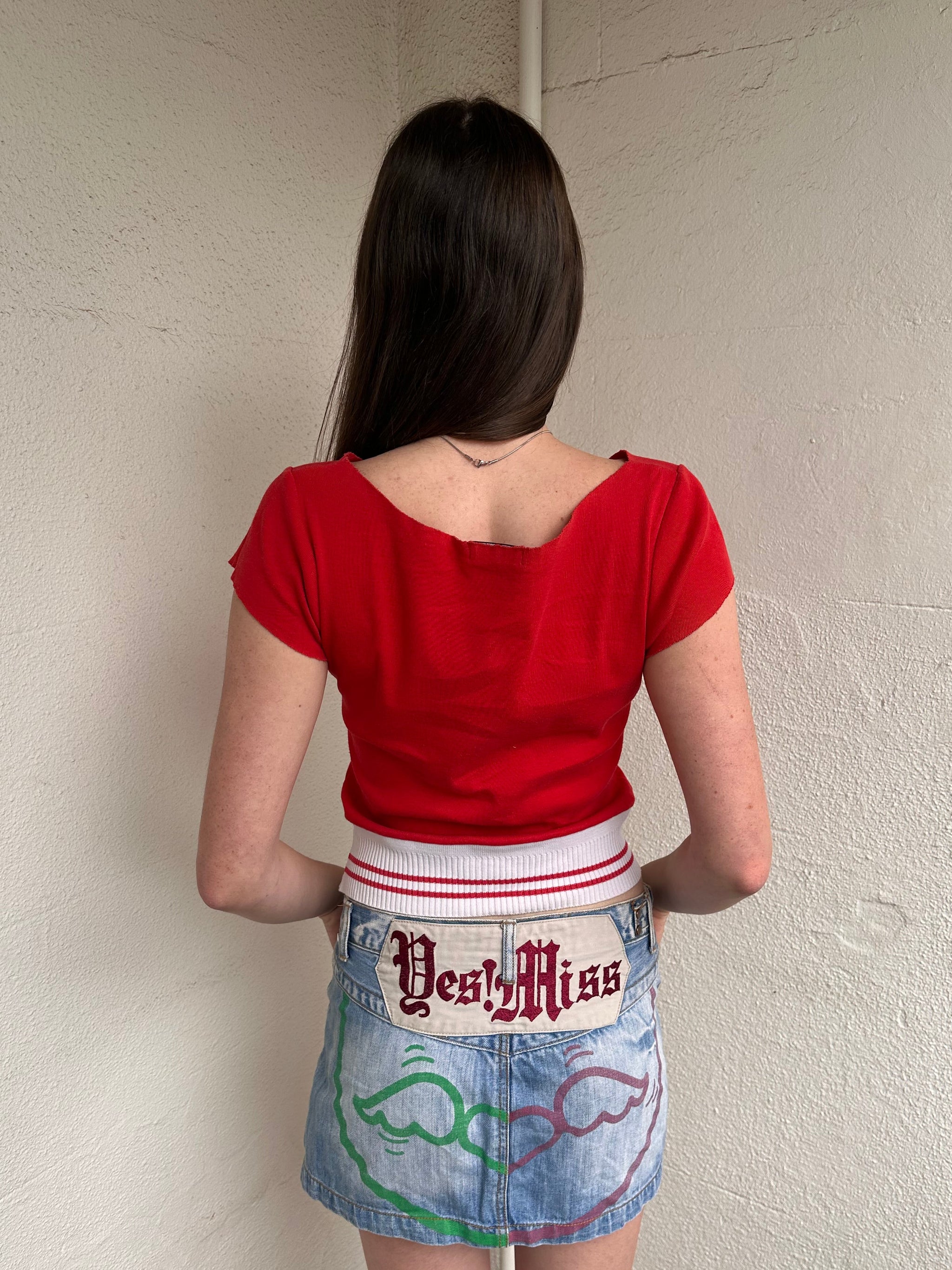 Women wearing a 00s Y2K Baseball-style red baby t-shirt with a wide neckline and white elasticated hem.