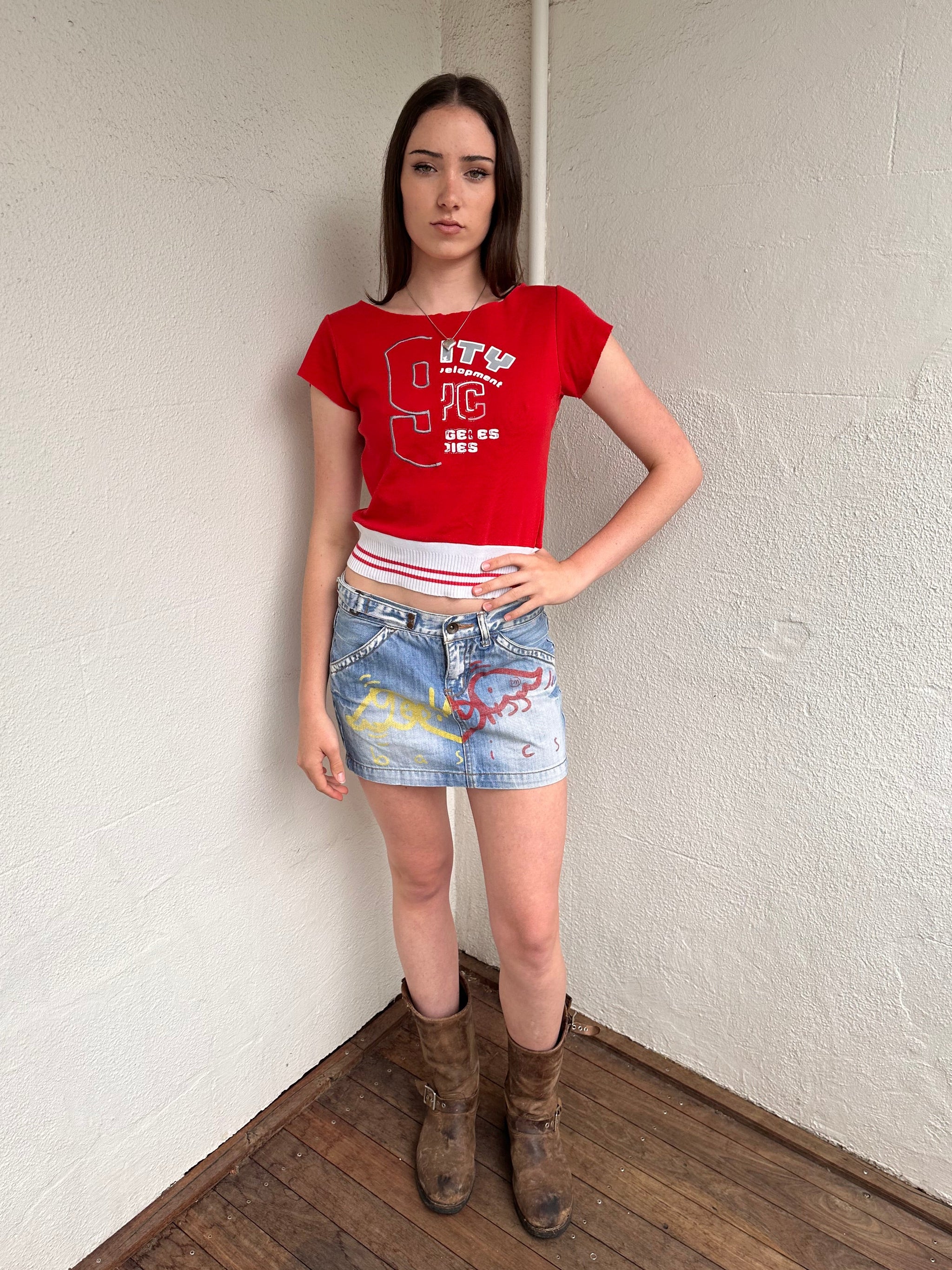 Women wearing a 00s Y2K Baseball-style red baby t-shirt with a wide neckline and white elasticated hem.