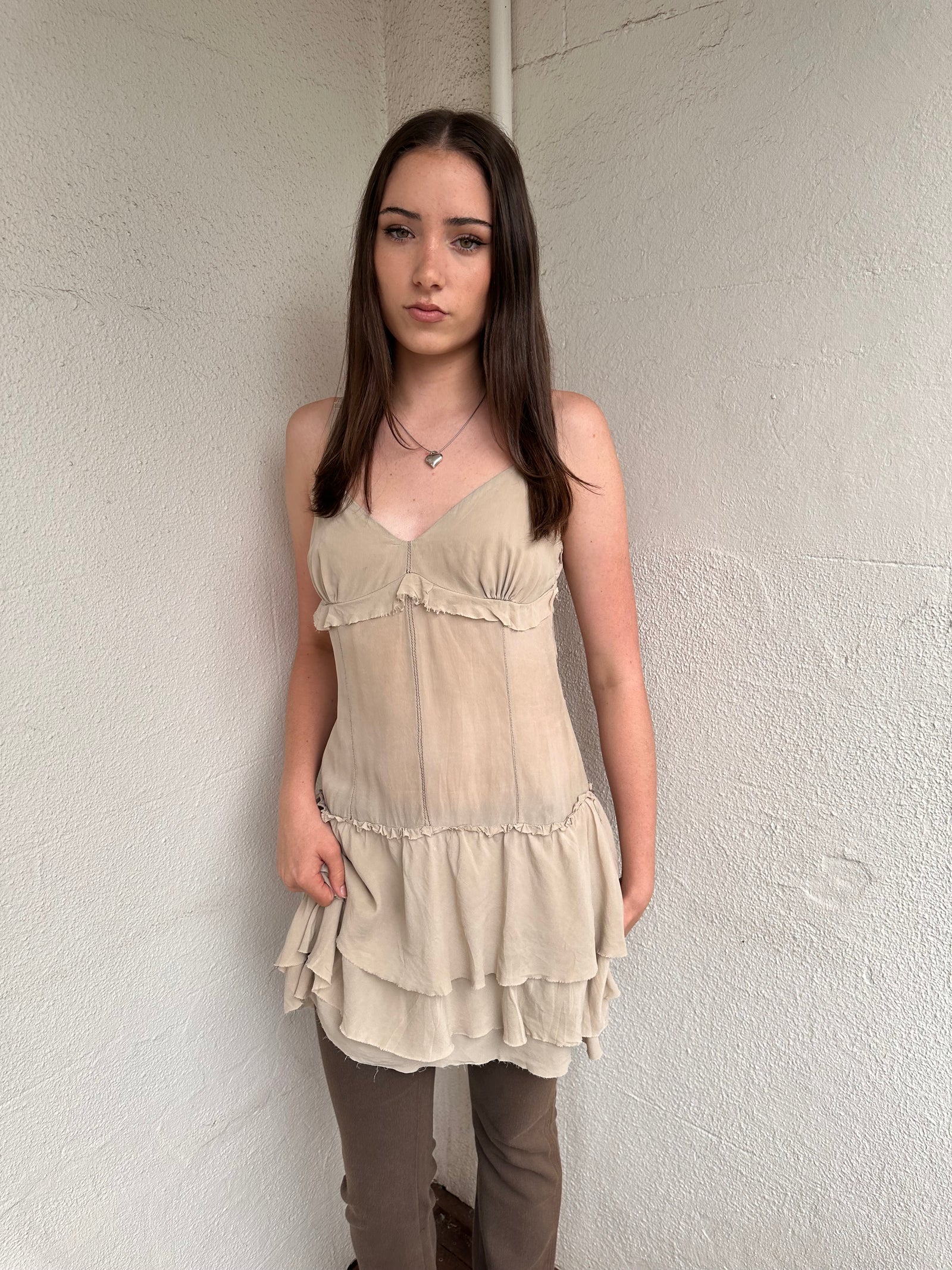 Women wearing a 00s Y2K Light beige boho layered mini dress with a flowy silhouette and soft textured fabric.