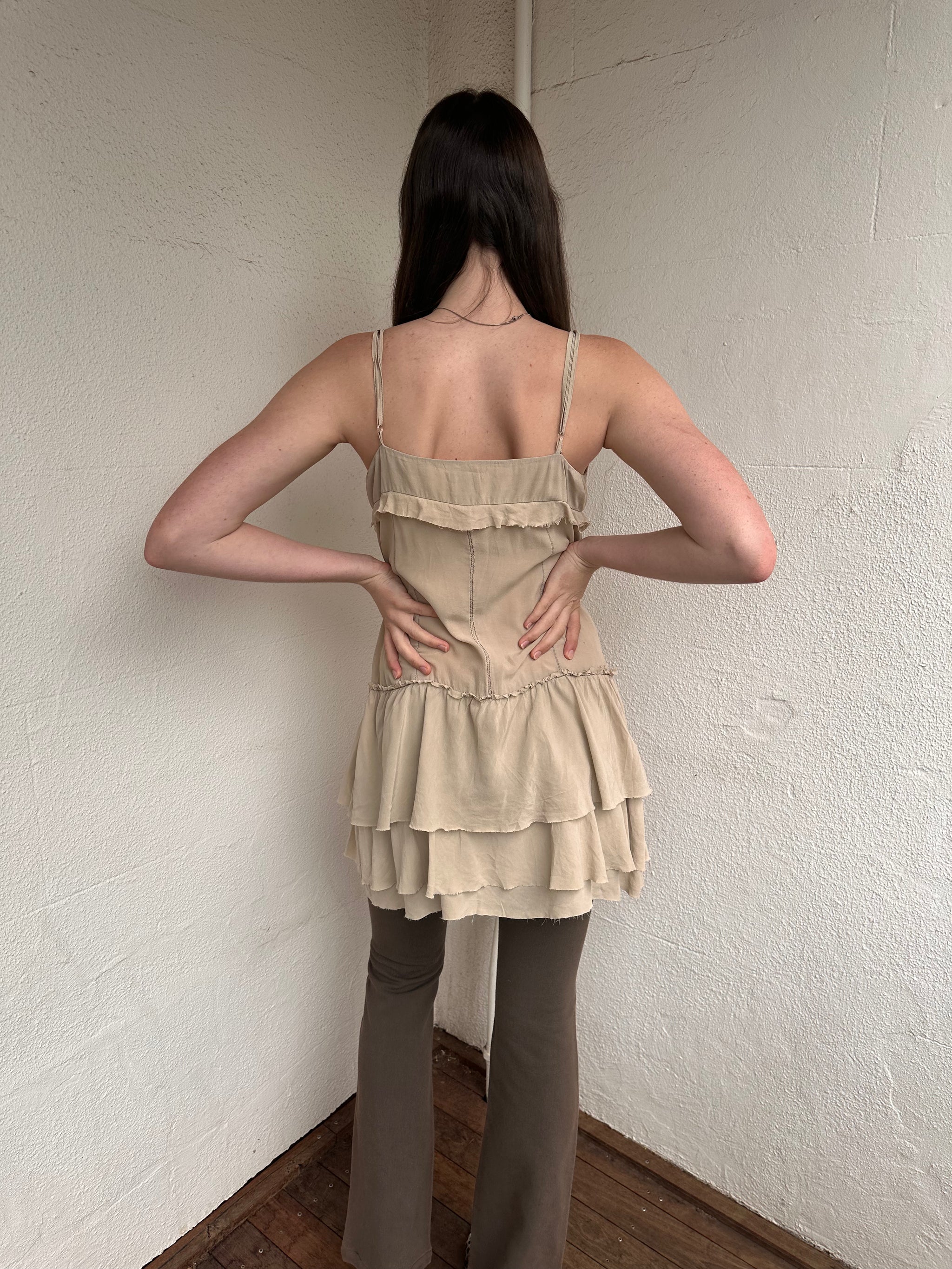 Women wearing a 00s Y2K Light beige boho layered mini dress with a flowy silhouette and soft textured fabric.