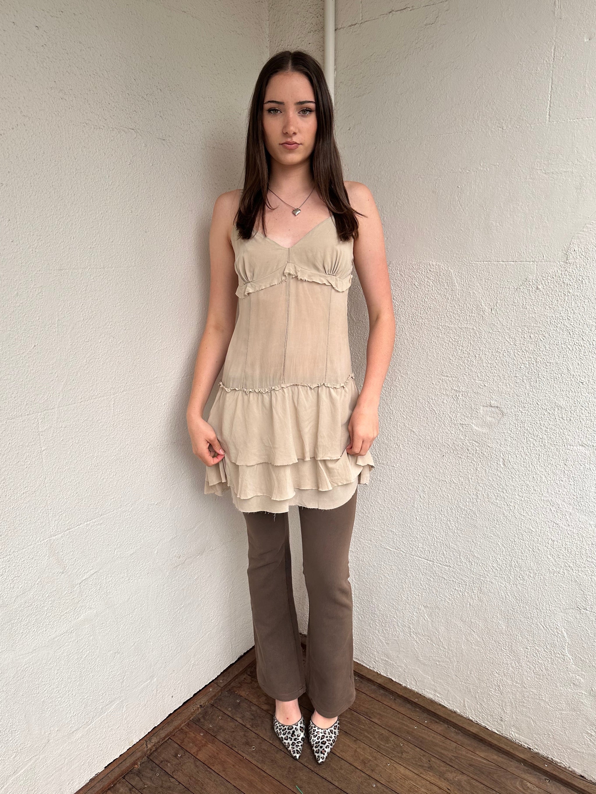 Women wearing a 00s Y2K Light beige boho layered mini dress with a flowy silhouette and soft textured fabric.