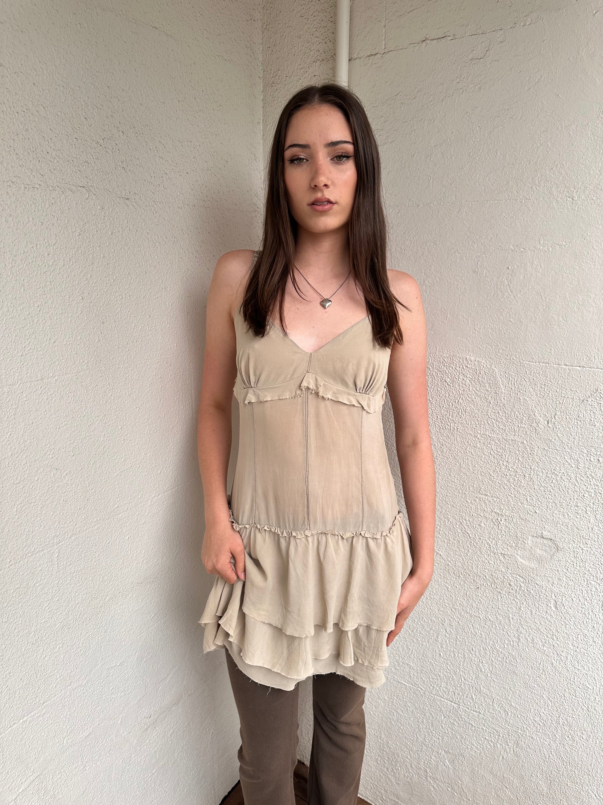 Women wearing a 00s Y2K Light beige boho layered mini dress with a flowy silhouette and soft textured fabric.
