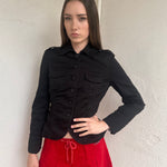 Women wearing a 00s Y2K Black fitted button-up jacket from the 2000s crafted from stretch cotton