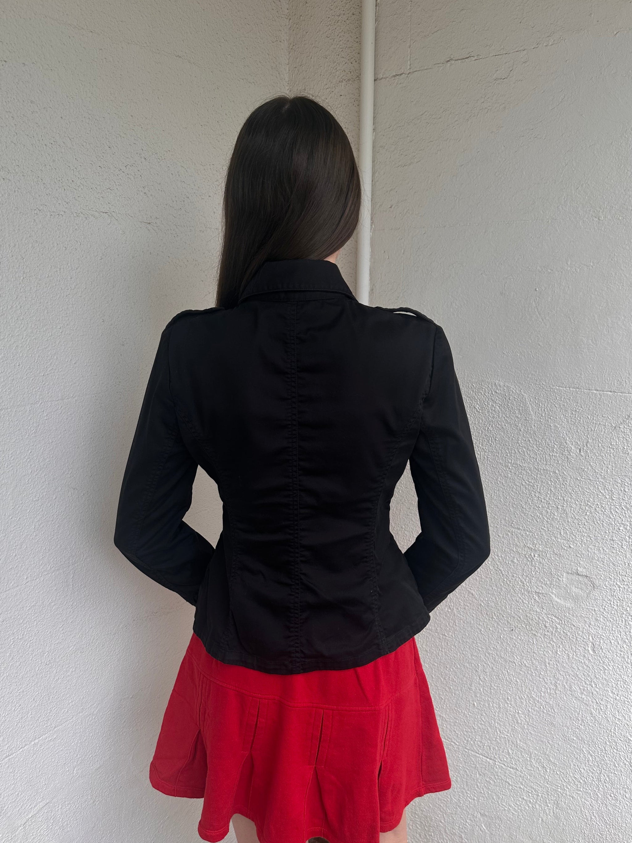 Women wearing a 00s Y2K Black fitted button-up jacket from the 2000s crafted from stretch cotton