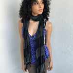 Woman wearing a Y2K 90s Black shimmer stripe scarf from the 00s.