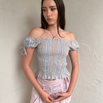 Women wearing a 00s Y2K Blue and beige stripe milkmaid top with a gathered full body and small cap sleeves. 