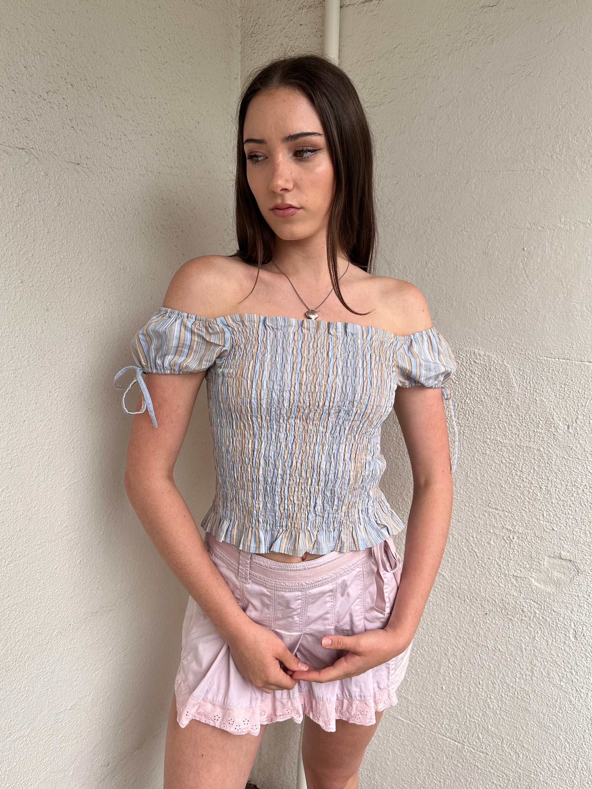 Women wearing a 00s Y2K Blue and beige stripe milkmaid top with a gathered full body and small cap sleeves. 