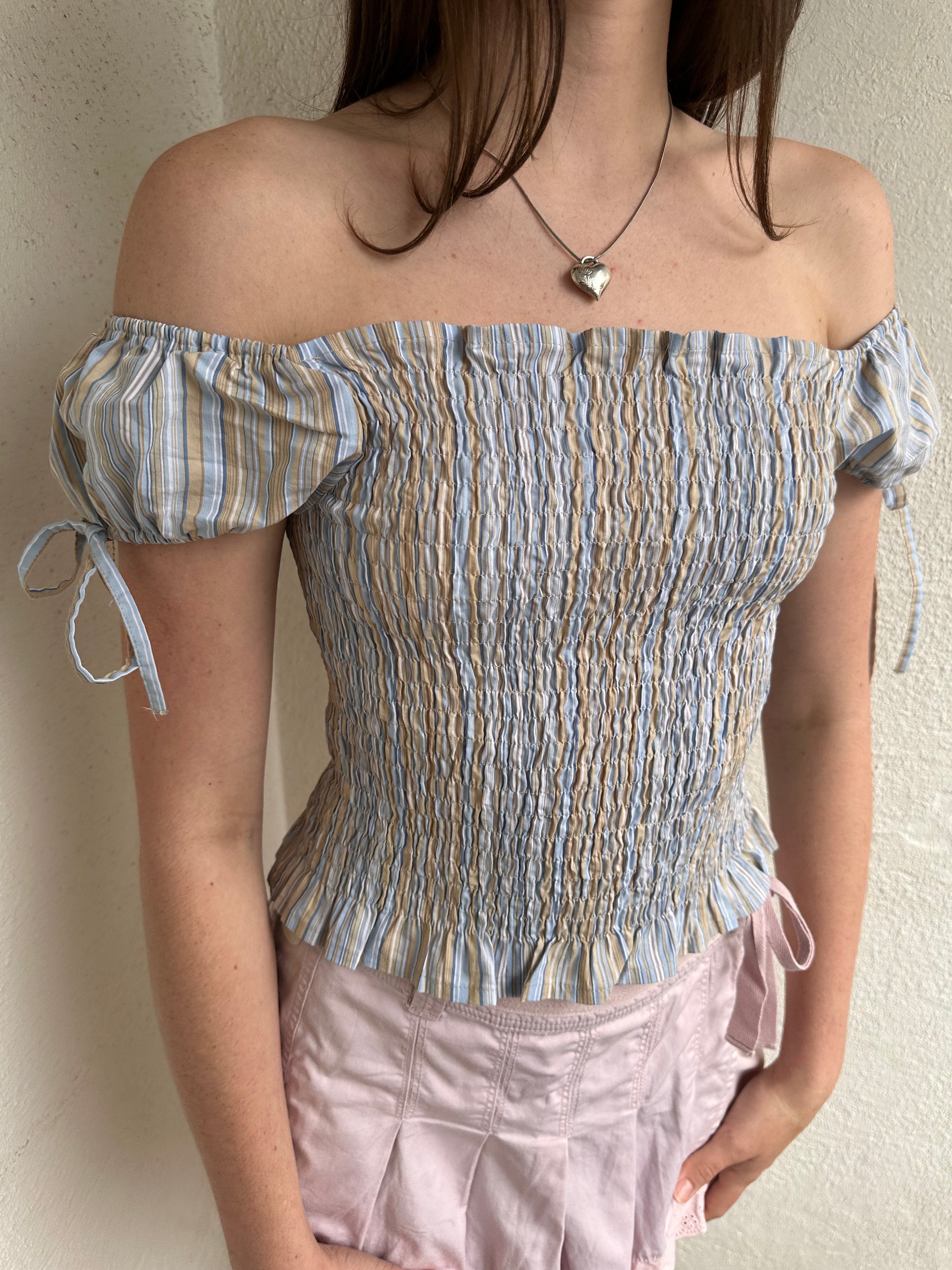 Women wearing a 00s Y2K Blue and beige stripe milkmaid top with a gathered full body and small cap sleeves. 