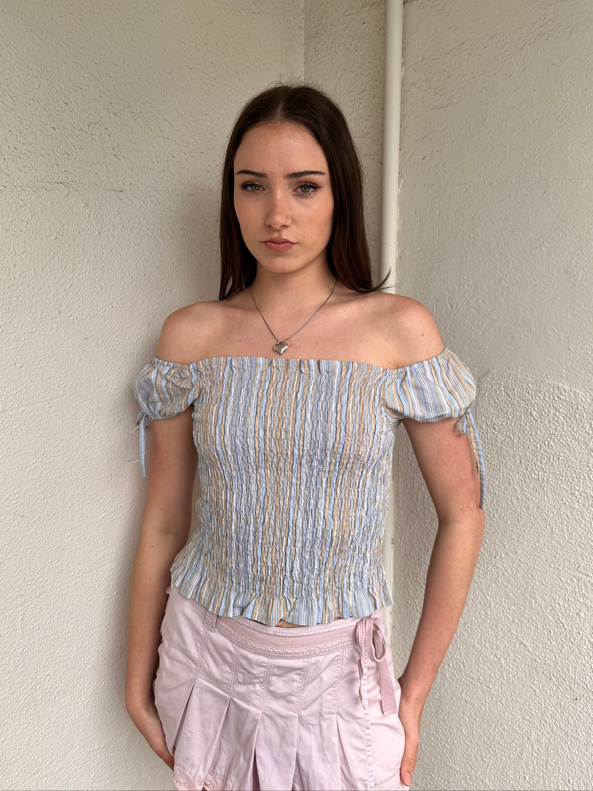 Women wearing a 00s Y2K Blue and beige stripe milkmaid top with a gathered full body and small cap sleeves. 