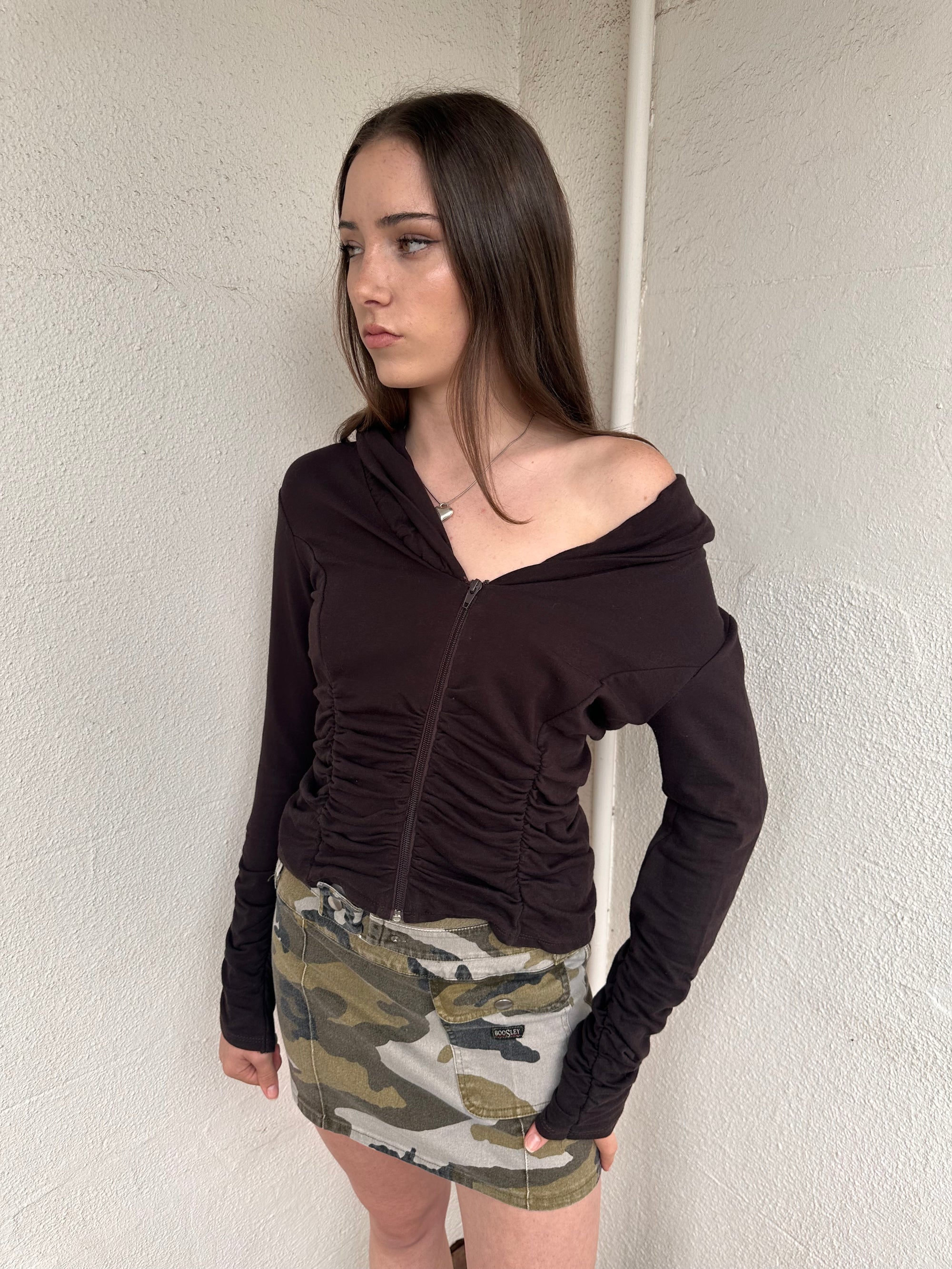 Women wearing a 00s Y2K Brown cinched zip-up cardigan featuring a wide collared neckline and fitted waist. 