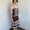 Woman Dressed in Y2K Brown and pink lace trim two piece set featuring a cami top and matching skirt detailed with cream lace and tulle trim throughout.