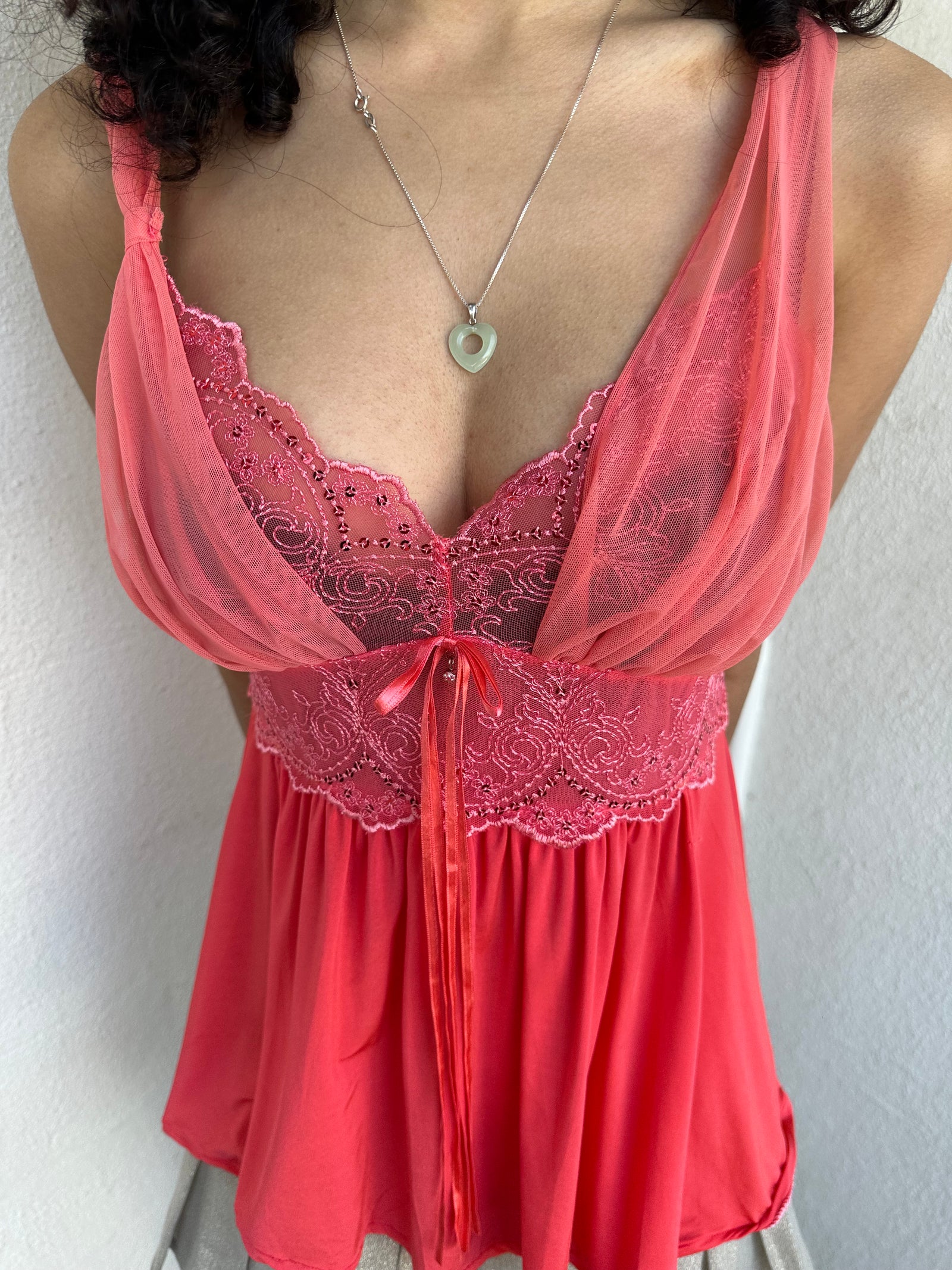 Woman wearing a Y2K 00s Coral cami featuring a mesh layered bust with delicate floral embroidery, lace trim, and subtle sequin details