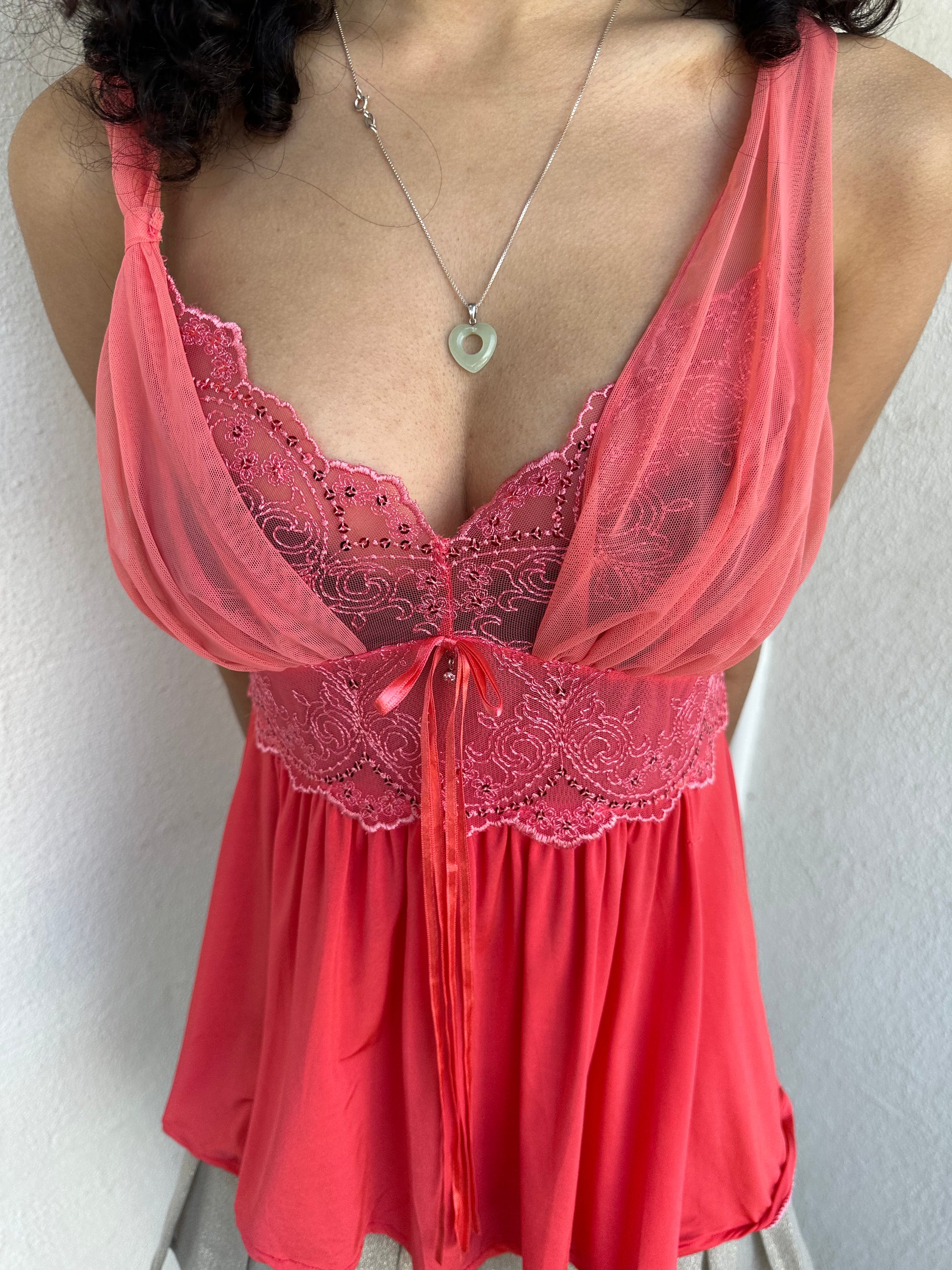 Woman wearing a Y2K 00s Coral cami featuring a mesh layered bust with delicate floral embroidery, lace trim, and subtle sequin details
