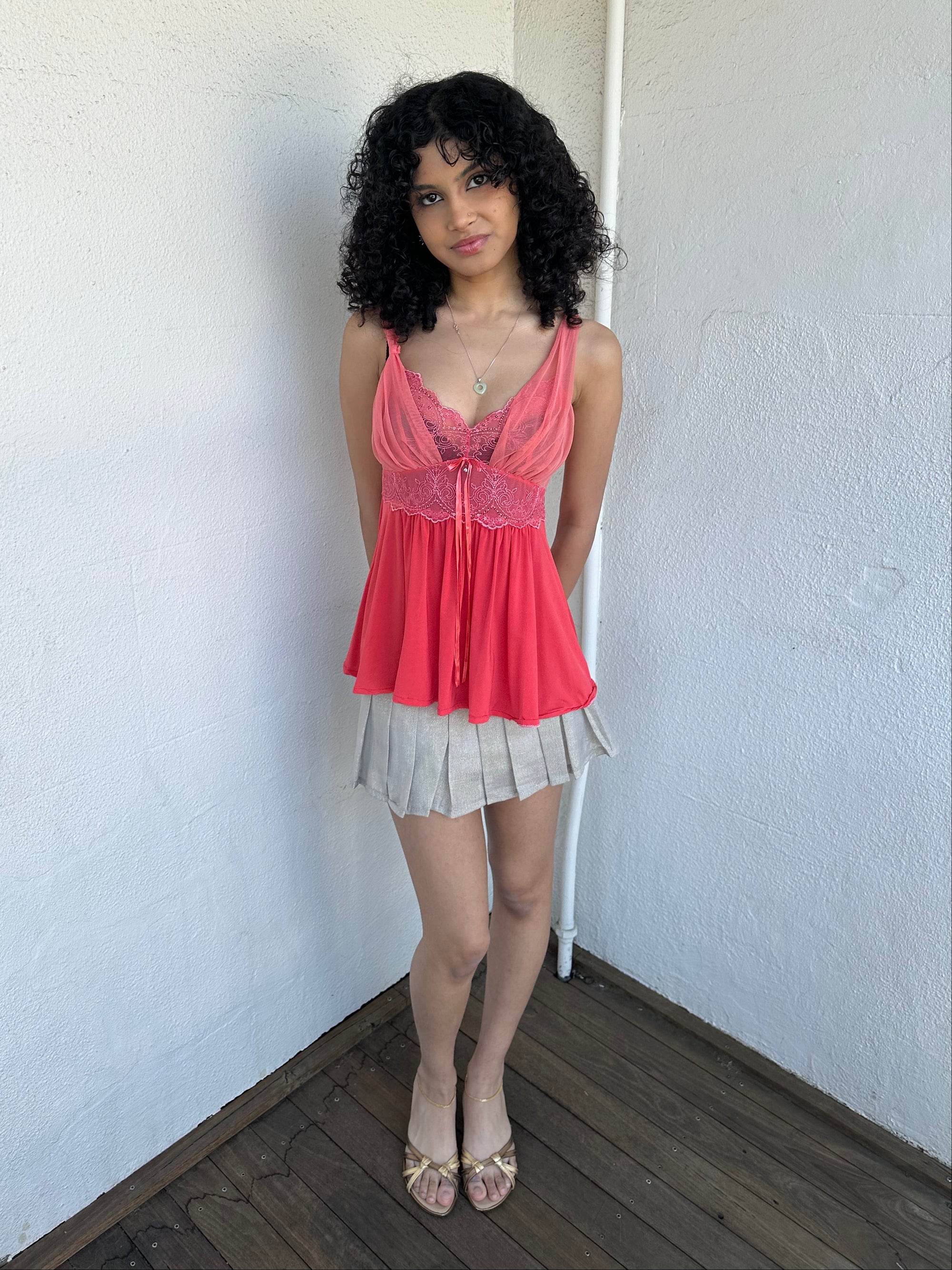 Woman wearing a Y2K 00s Coral cami featuring a mesh layered bust with delicate floral embroidery, lace trim, and subtle sequin details