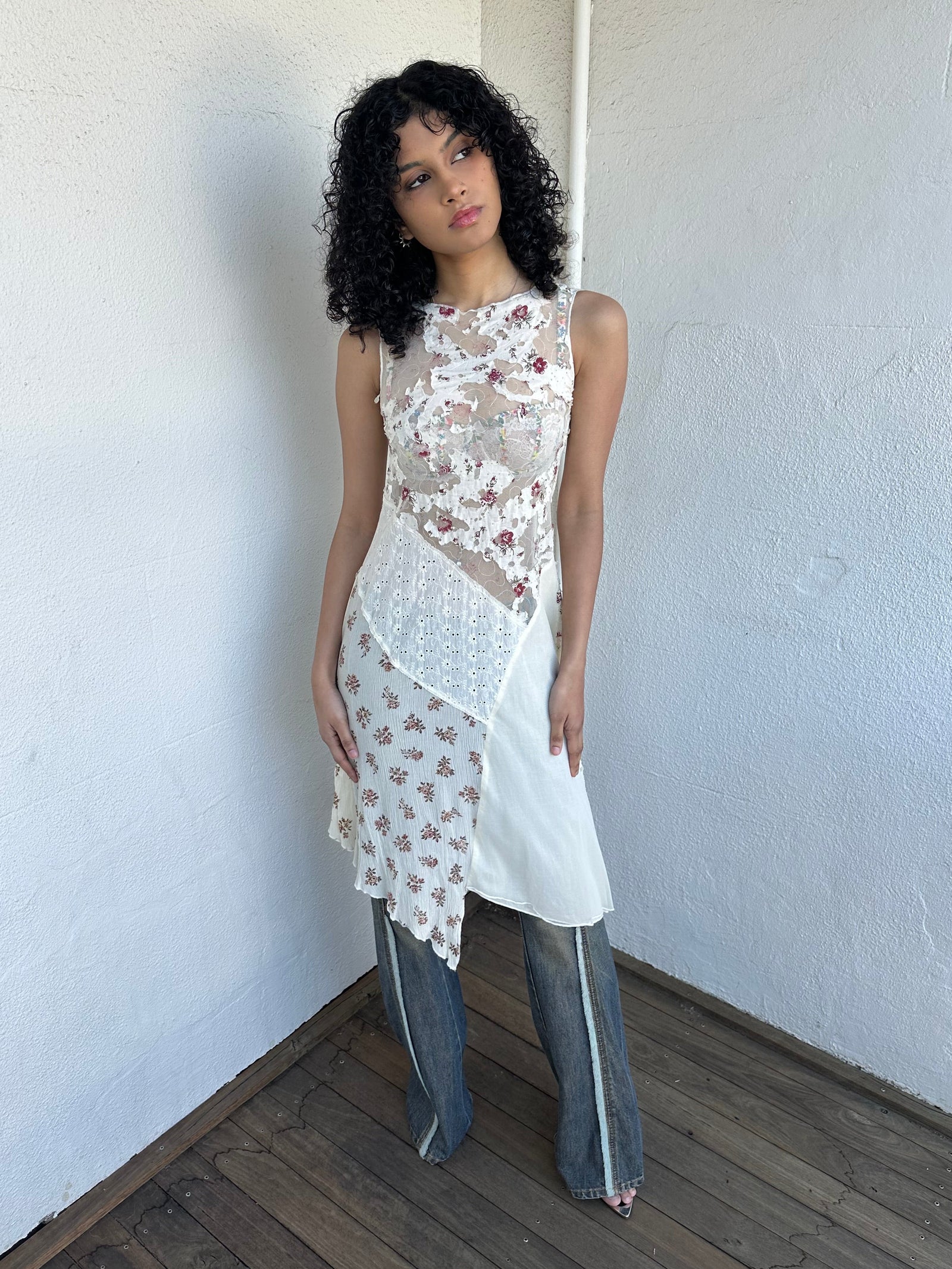 Woman wearing a Y2K 00s Cream lace midi dress with a pink floral pattern and a mix of sheer and non-sheer lace panels