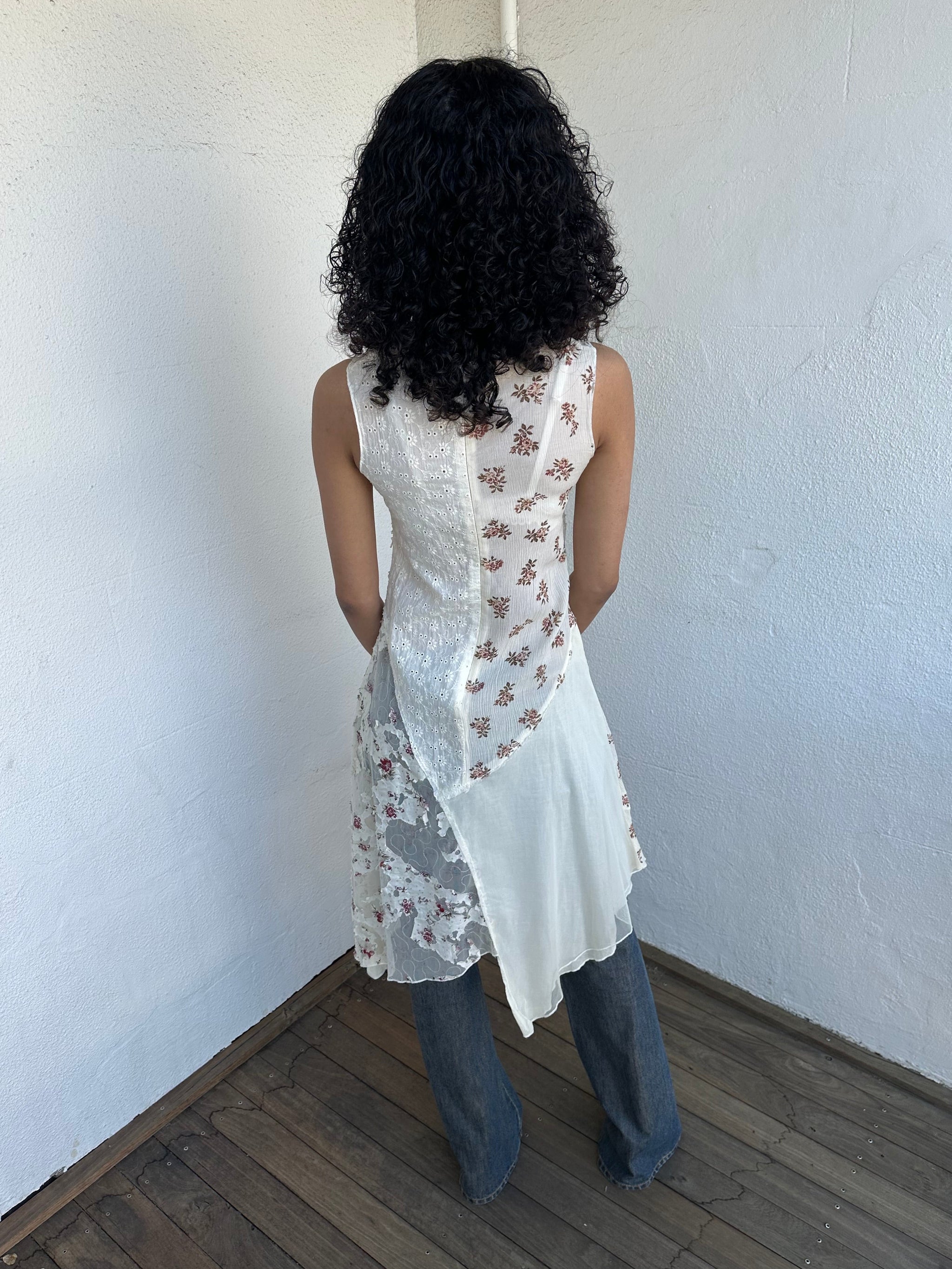 Woman wearing a Y2K 00s Cream lace midi dress with a pink floral pattern and a mix of sheer and non-sheer lace panels