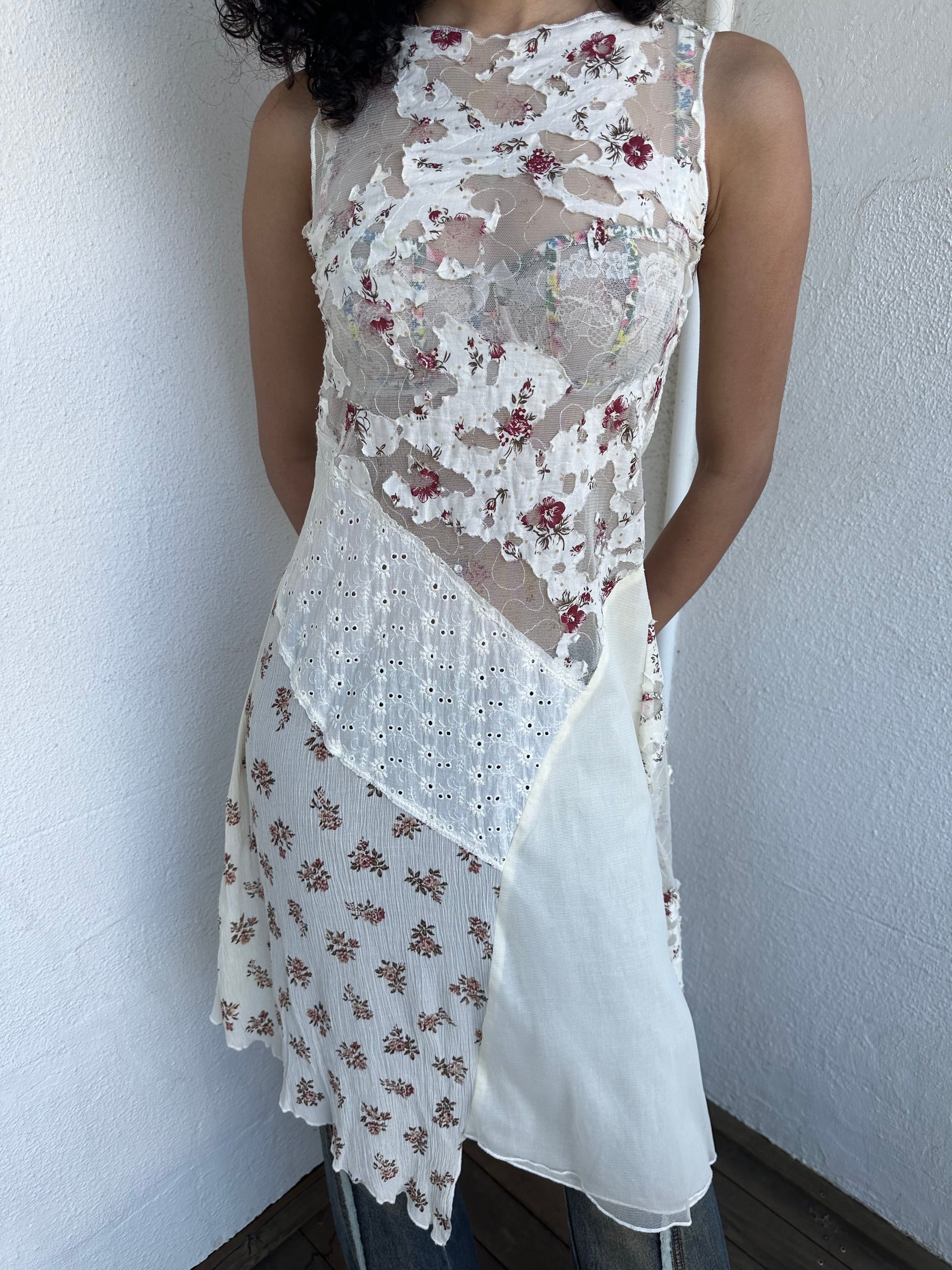 Woman wearing a Y2K 00s Cream lace midi dress with a pink floral pattern and a mix of sheer and non-sheer lace panels