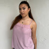 Woman Dressed in Y2K 00s Dusty pink lace trim cami featuring a soft dusty pink tone