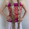 Woman Dressed in Y2K Gold sequin scarf featuring full sequin coverage with tassel ends.