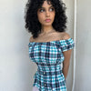 Woman wearing a Y2K 90s reworked vintage shirt transformed into a summer classic green and blue check milkmaid style top