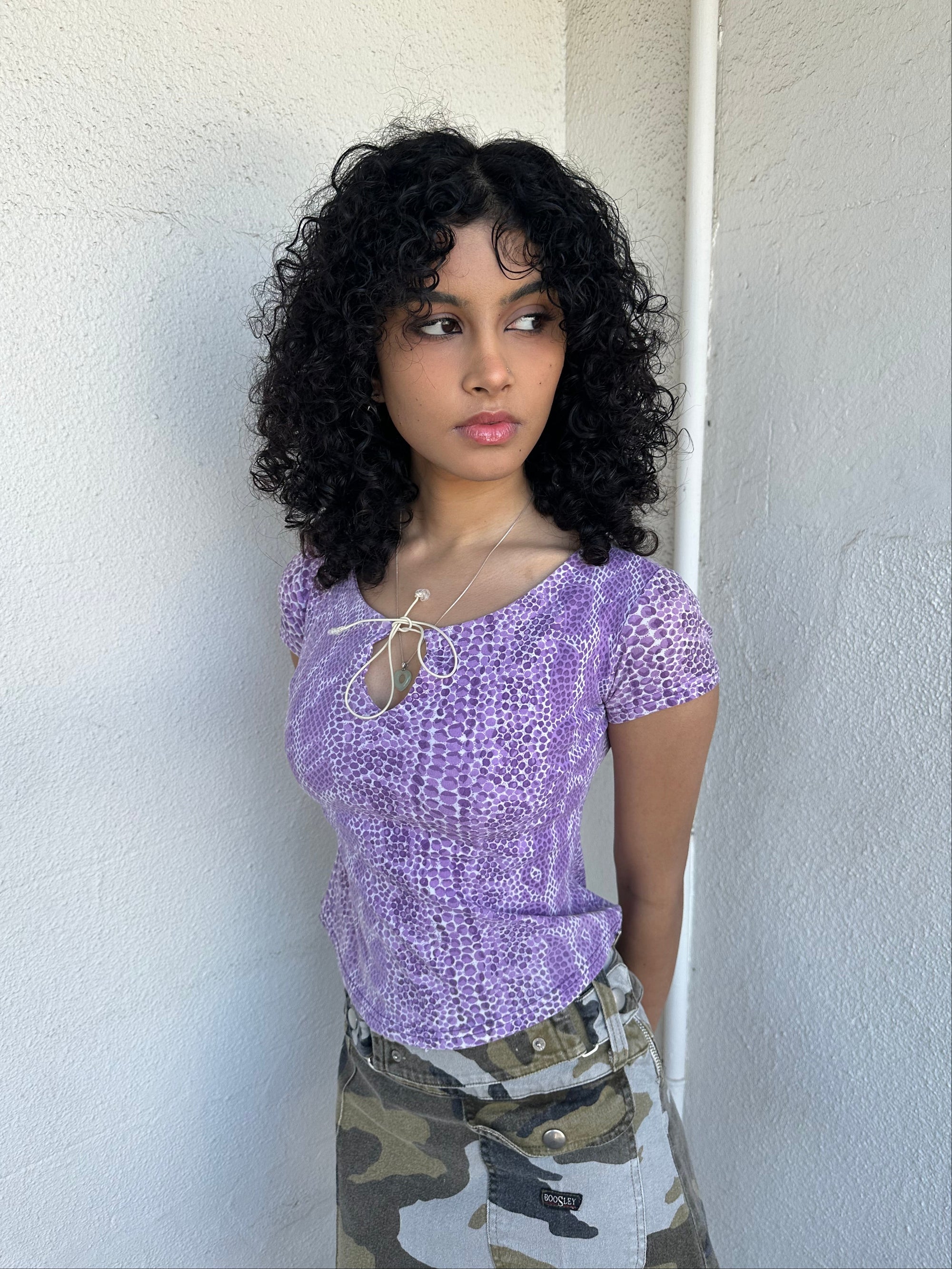 Women wearing a 00s Y2K Lilac snake print t-shirt featuring a keyhole front opening with adjustable tie design.