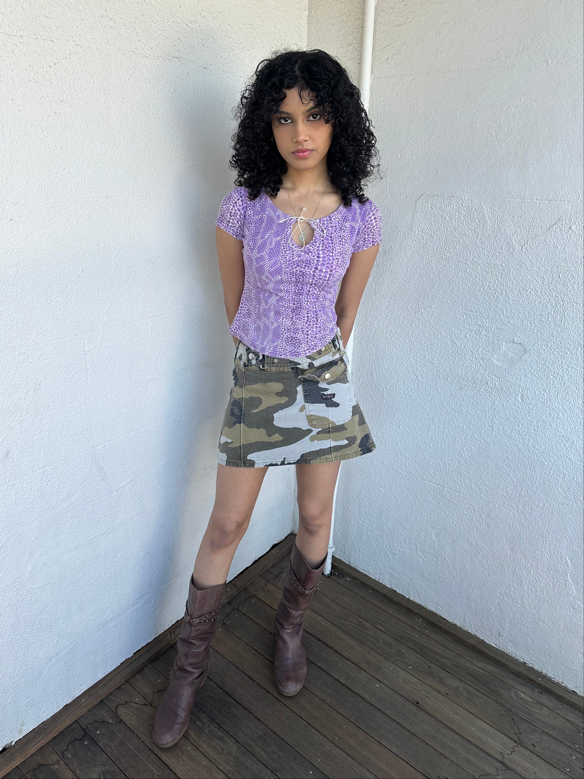 Women wearing a 00s Y2K Lilac snake print t-shirt featuring a keyhole front opening with adjustable tie design.