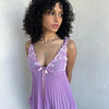 Woman wearing a Y2K 00s Lilac floral embroidered bust cami with a floaty, pleated A-line shape