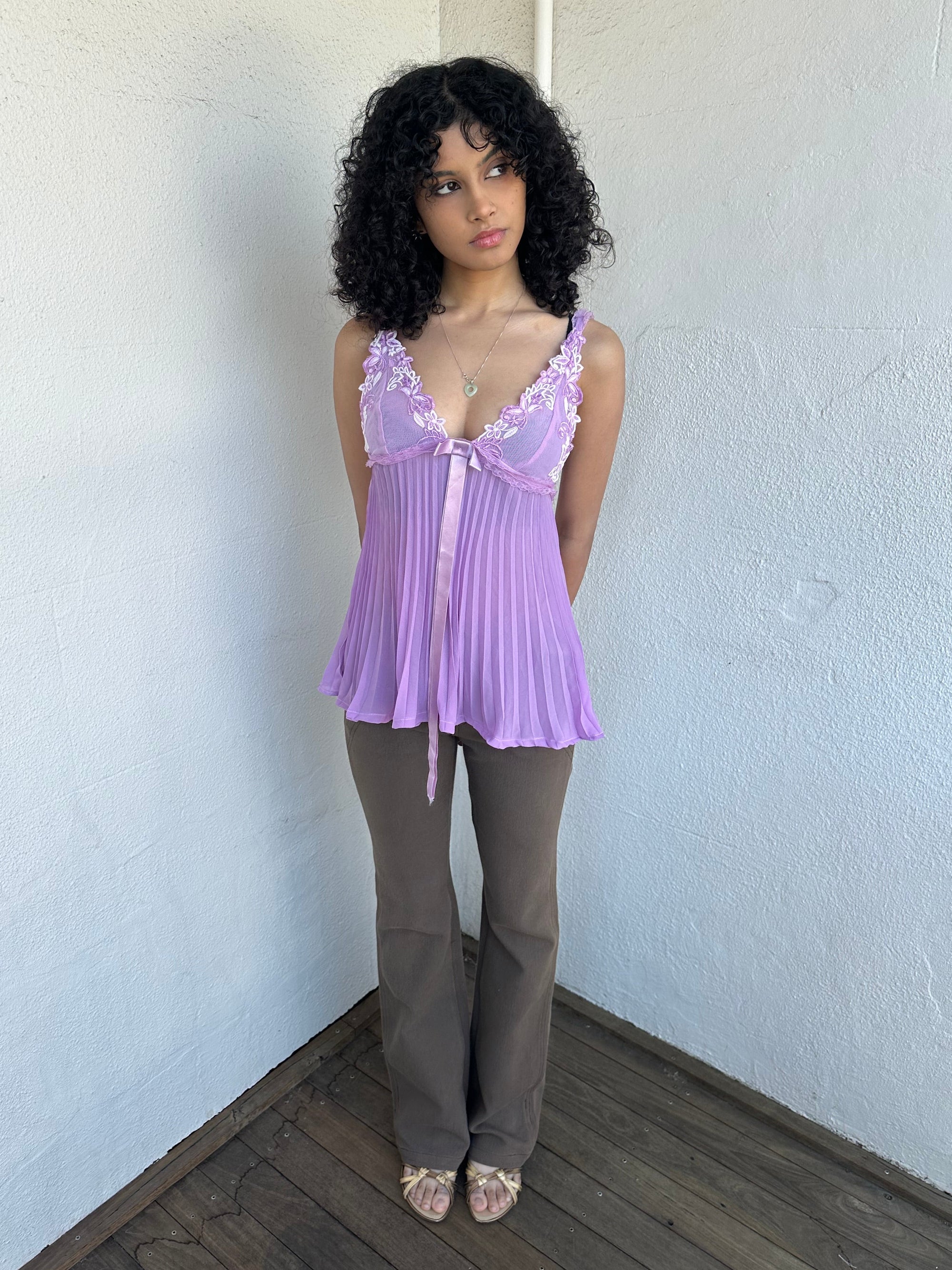 Woman wearing a Y2K 00s Lilac floral embroidered bust cami with a floaty, pleated A-line shape