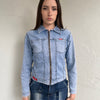 Woman wearing a Y2K 90s Miss Sixty light denim jacket, 3structured fit and stretch denim fabric