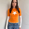 Woman wearing a Y2K 00s Y2K Orange star layered long sleeve top.