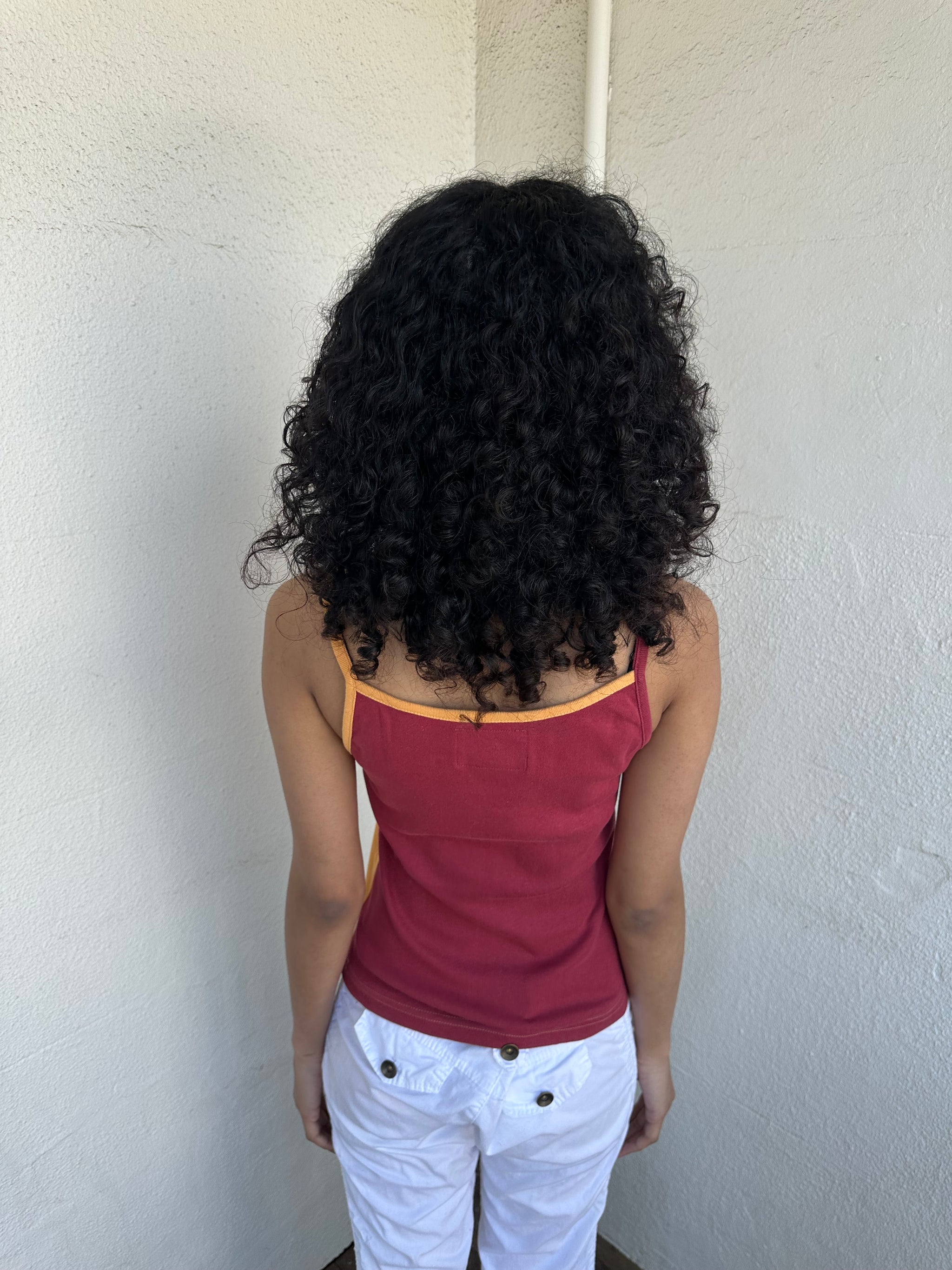 Woman wearing a Y2K 00s Orange & burgundy mandala print layered  cami