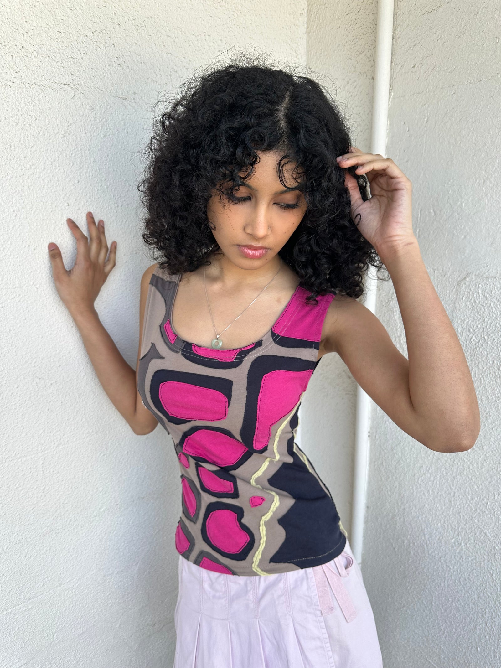 Hot pink, beige, and black appliqué patchwork tank crafted from soft stretch fabric with contrast stitching. 