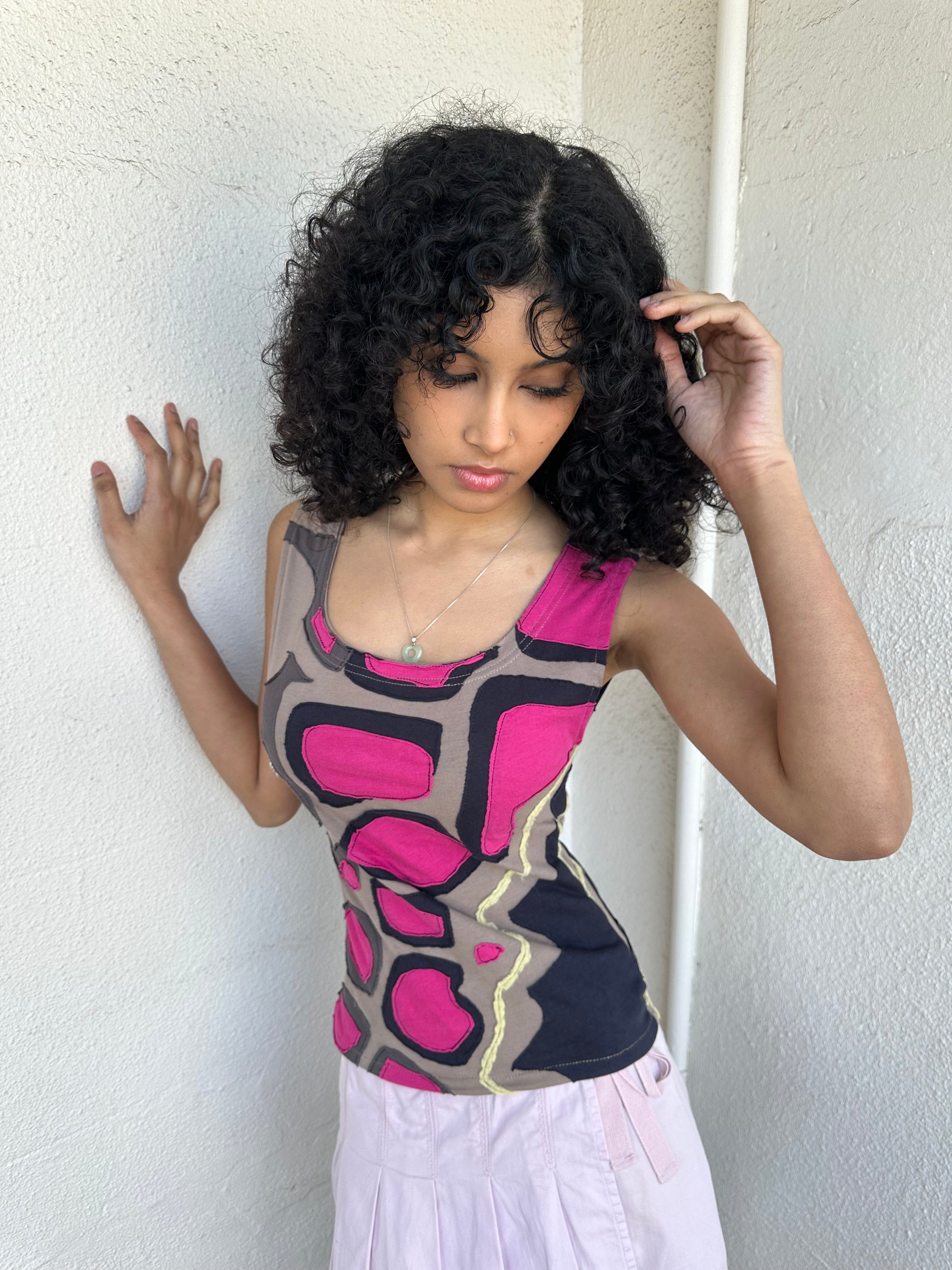 Hot pink, beige, and black appliqué patchwork tank crafted from soft stretch fabric with contrast stitching. 