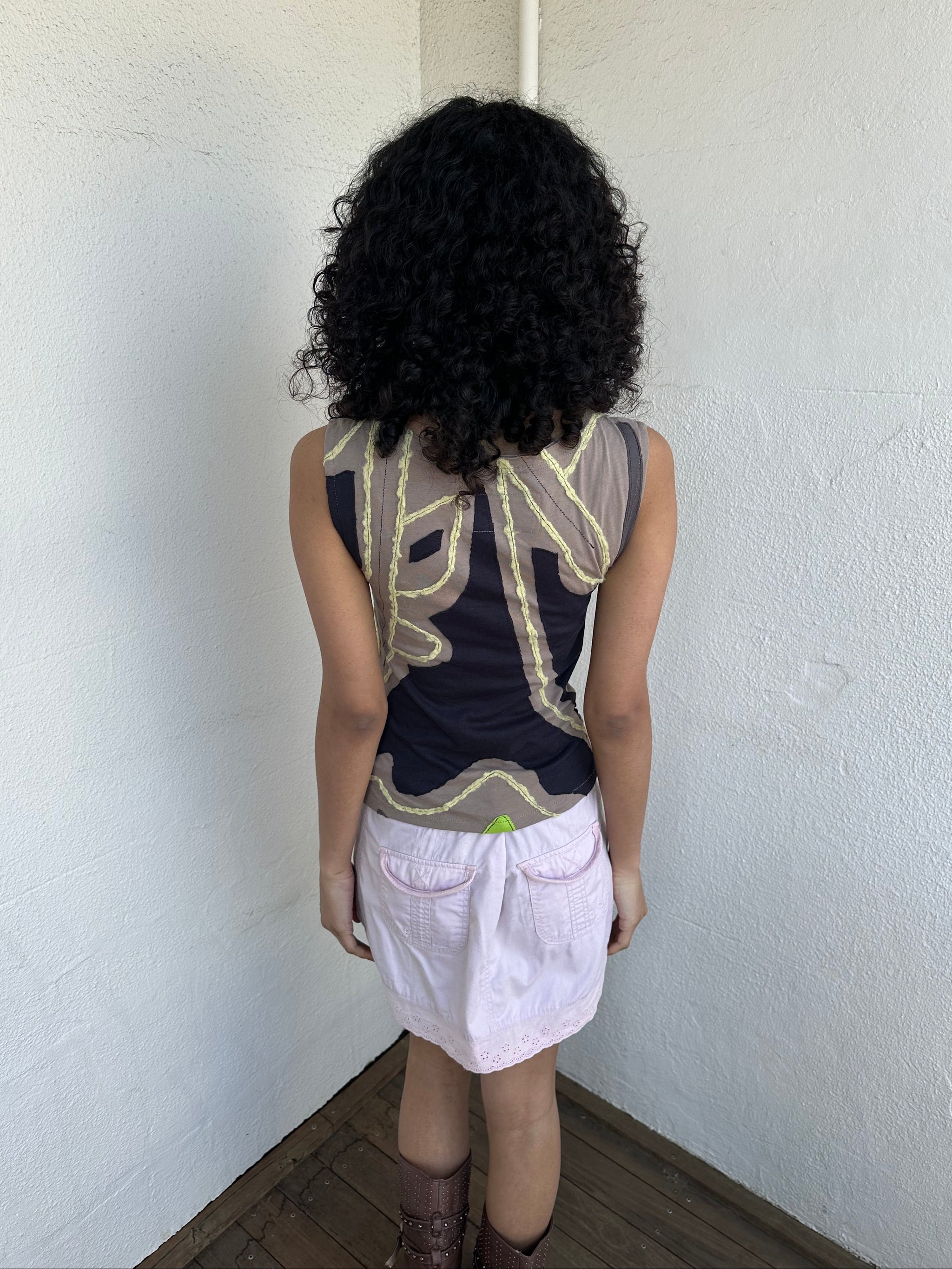 Hot pink, beige, and black appliqué patchwork tank crafted from soft stretch fabric with contrast stitching. 