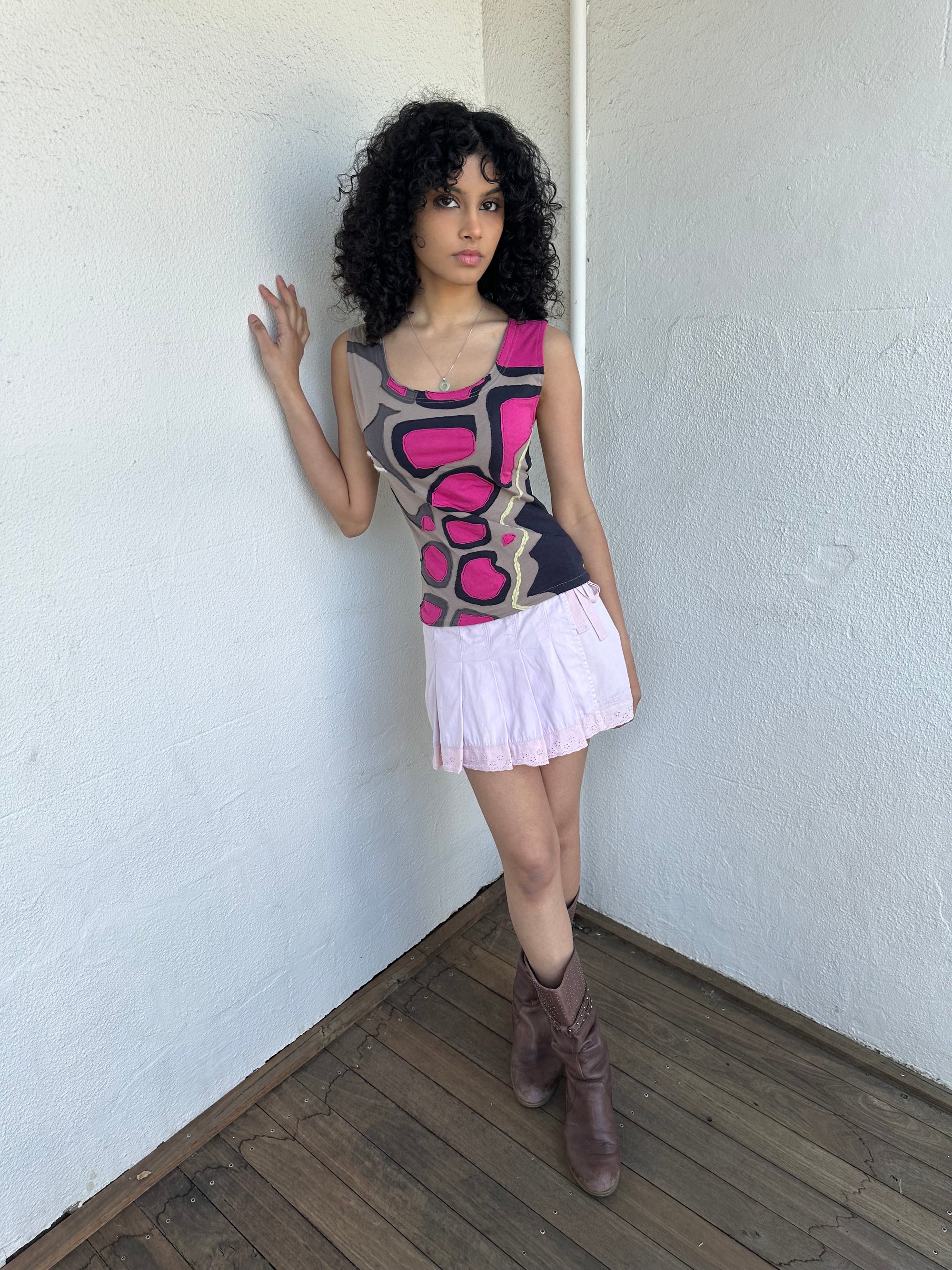 Hot pink, beige, and black appliqué patchwork tank crafted from soft stretch fabric with contrast stitching. 