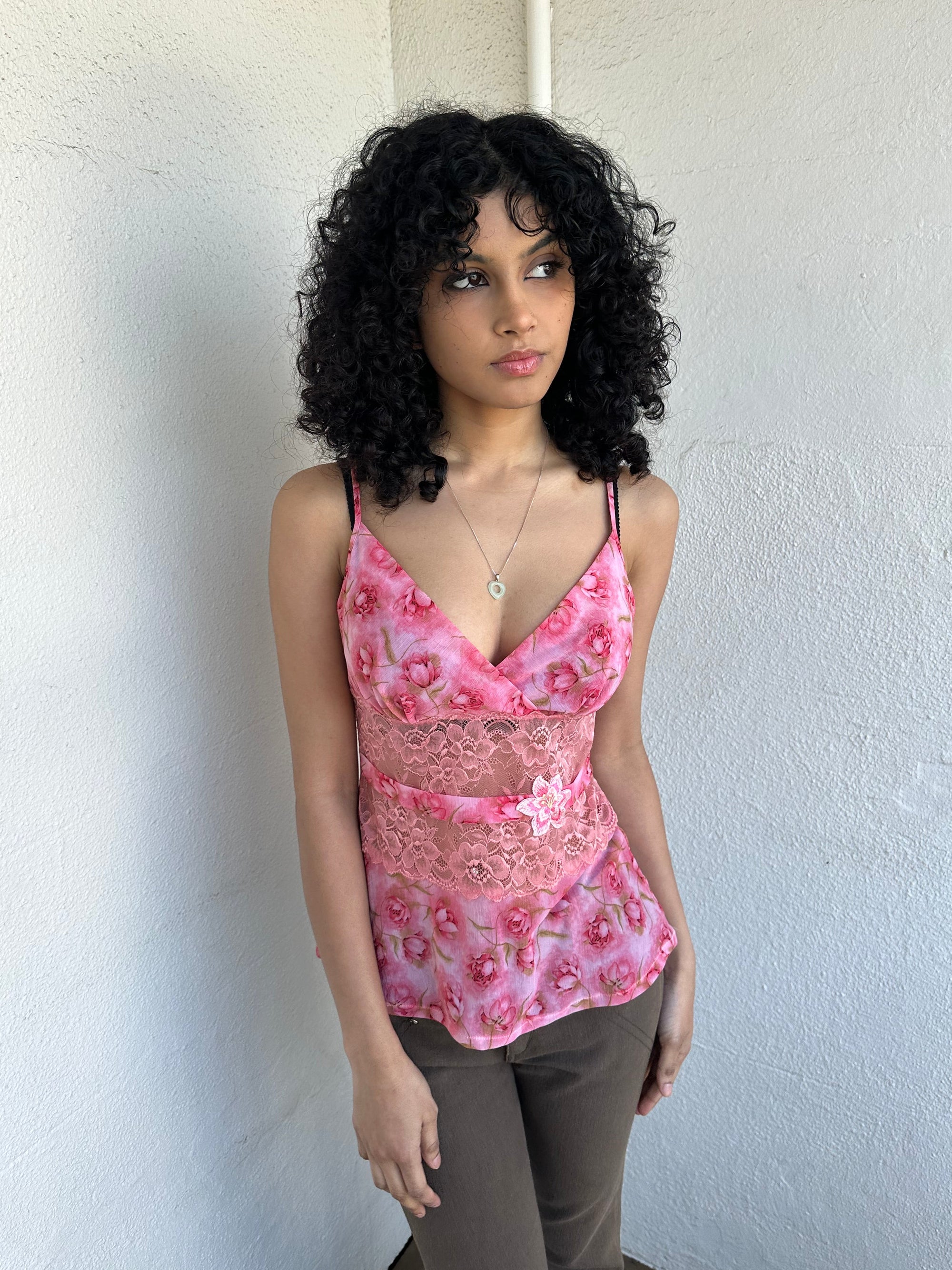 Woman wearing a Y2K 90s Beautiful pink floral mesh cami with a lace under bust cut-out and delicate embroidered flower detailing.