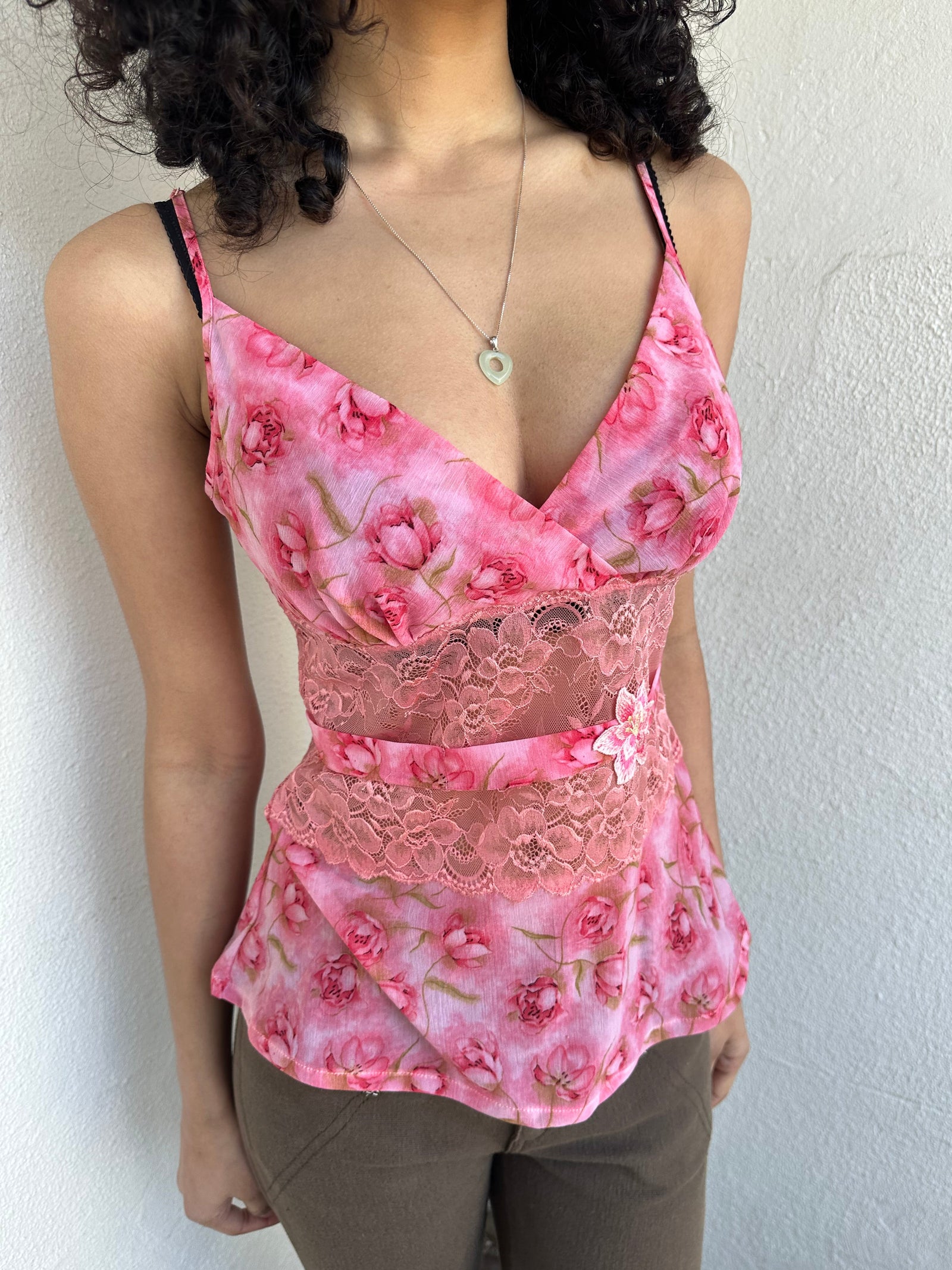 Woman wearing a Y2K 90s Beautiful pink floral mesh cami with a lace under bust cut-out and delicate embroidered flower detailing.