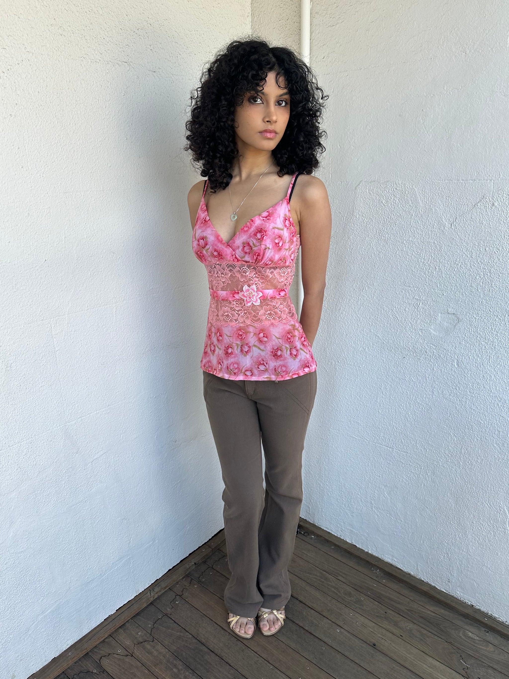 Woman wearing a Y2K 90s Beautiful pink floral mesh cami with a lace under bust cut-out and delicate embroidered flower detailing.