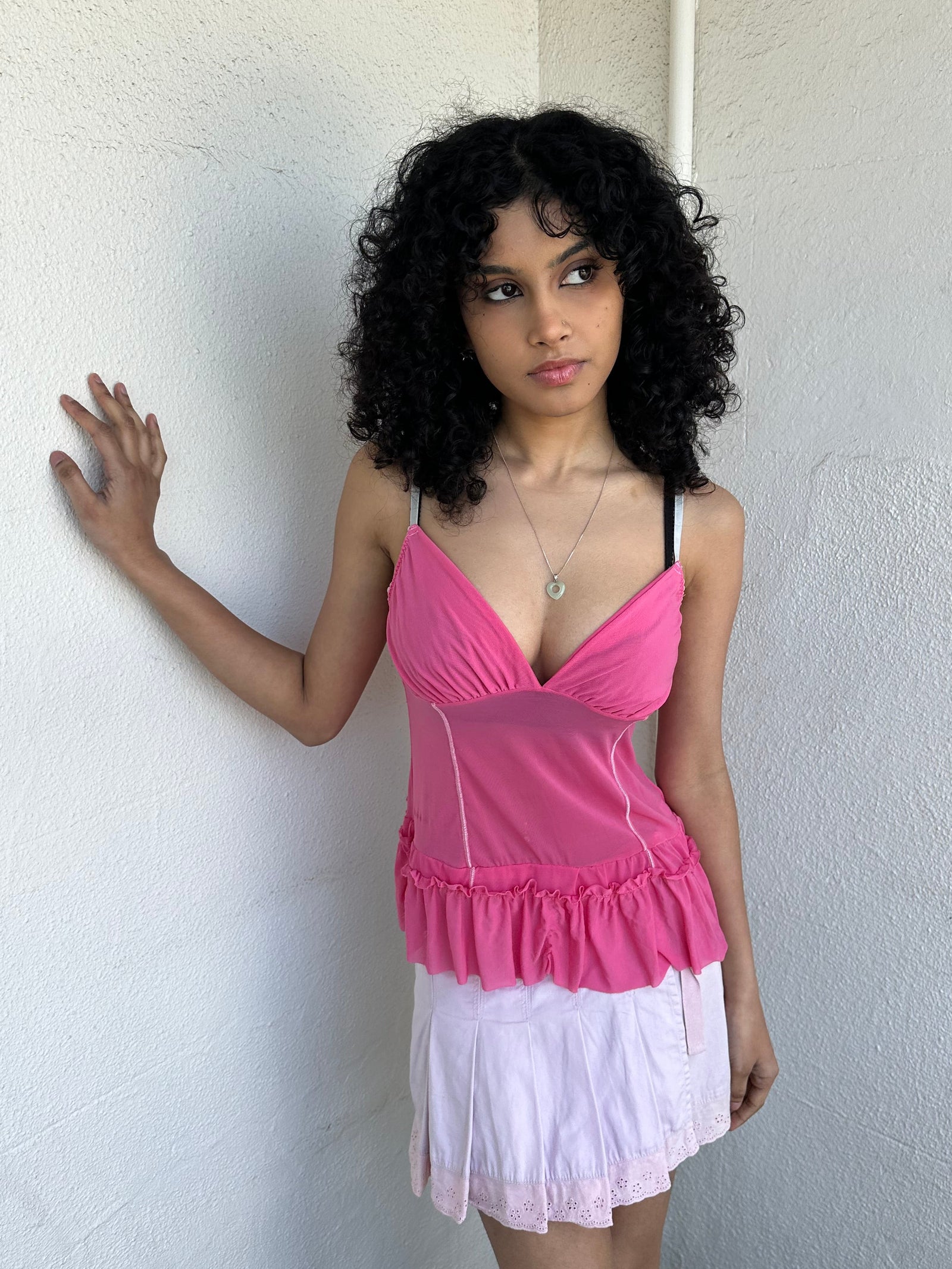 Women wearing a 00s Y2K Pink Y2K mesh ruffle hem cami with a soft, lightweight feel and subtle stretch.