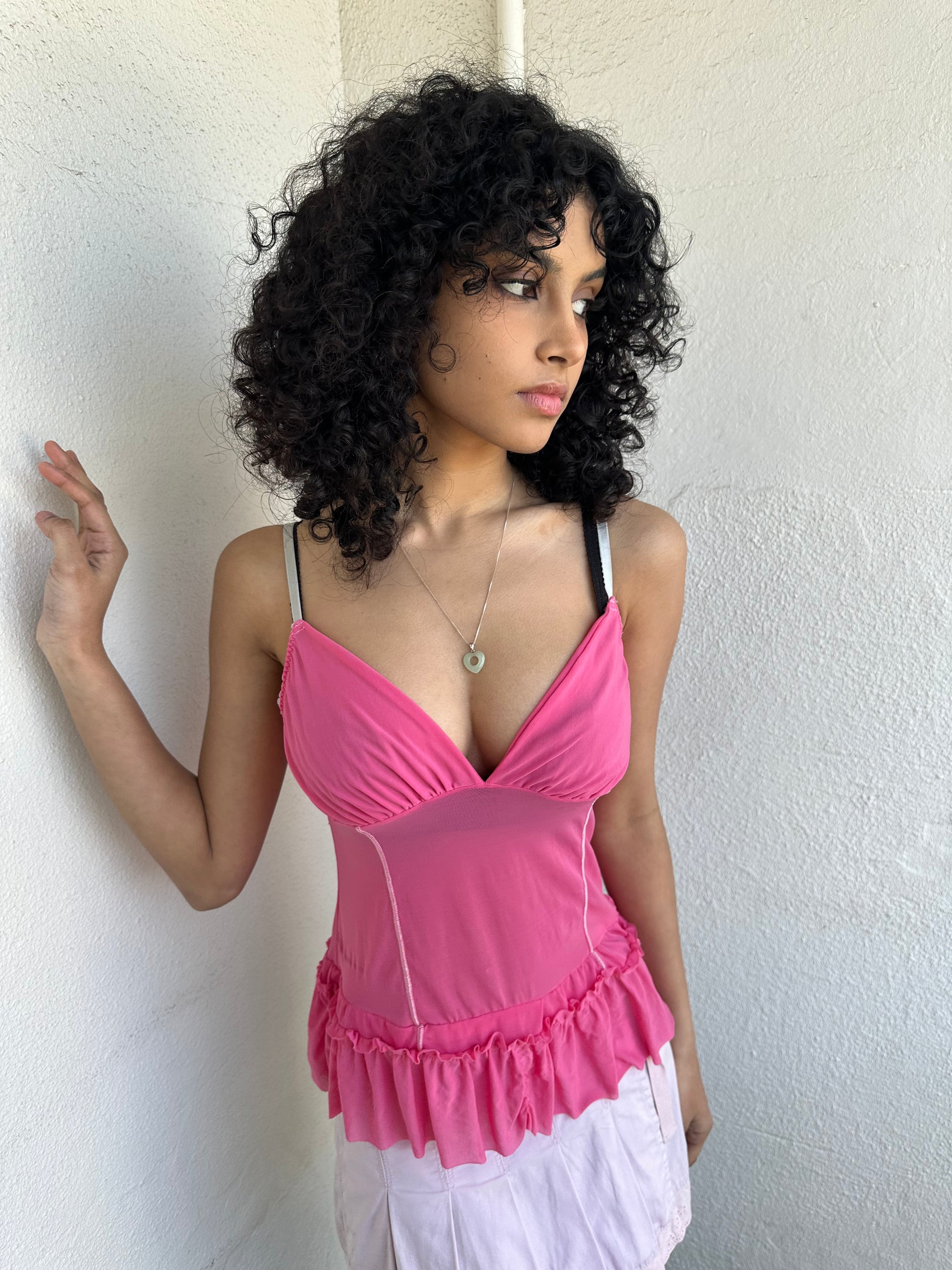 
Women wearing a 00s Y2K Pink Y2K mesh ruffle hem cami with a soft, lightweight feel and subtle stretch.