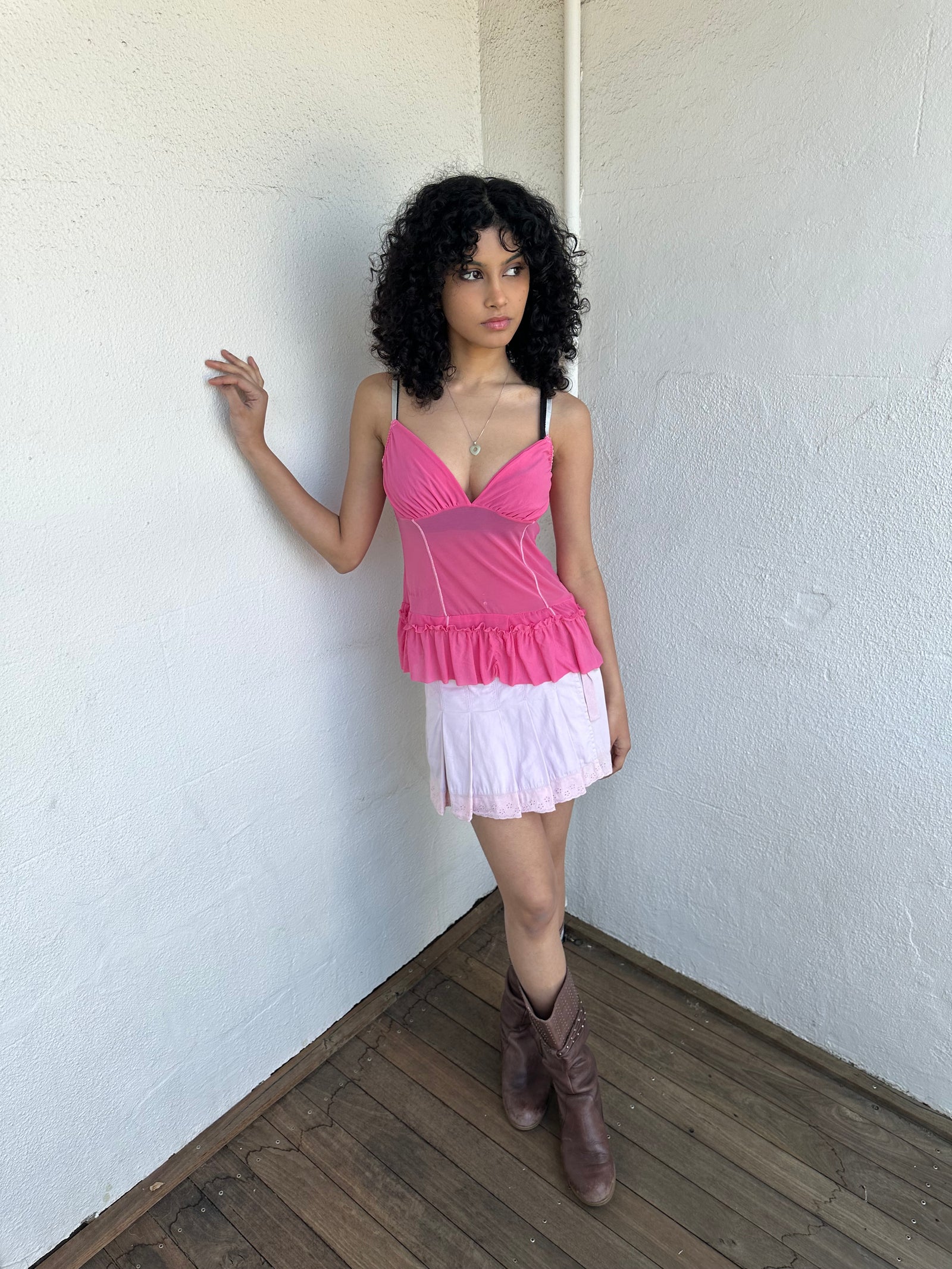Women wearing a 00s Y2K Pink Y2K mesh ruffle hem cami with a soft, lightweight feel and subtle stretch.