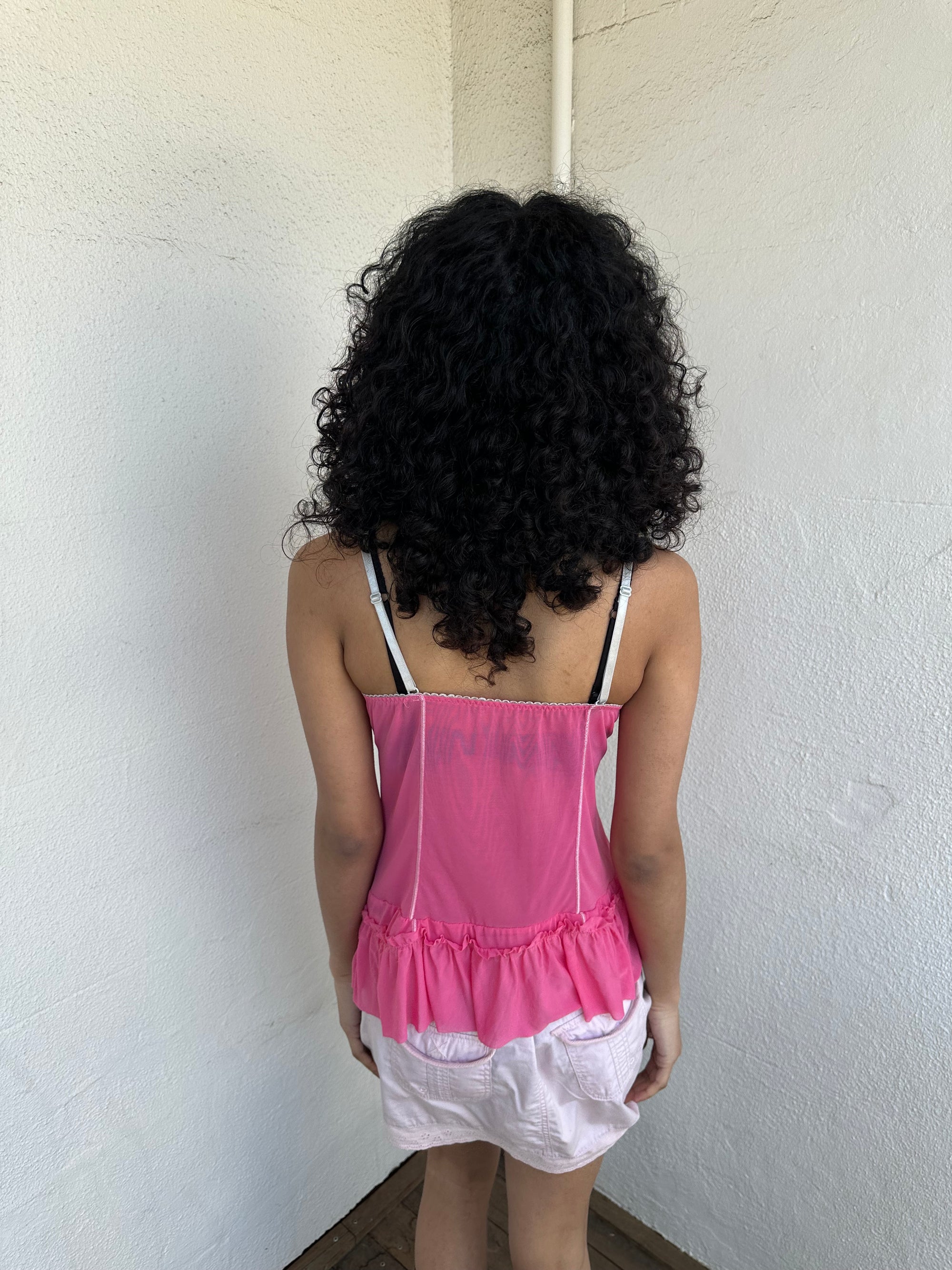 Women wearing a 00s Y2K Pink Y2K mesh ruffle hem cami with a soft, lightweight feel and subtle stretch.